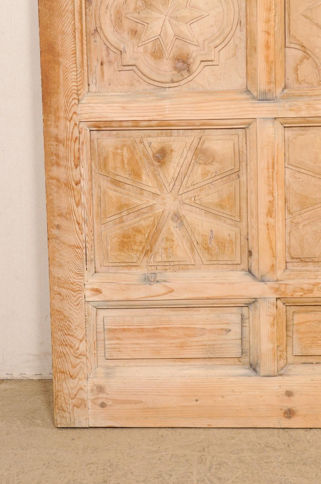 A Large-Sized Spanish Wooden Door w/Decoratively Carved Panels For Sale 1
