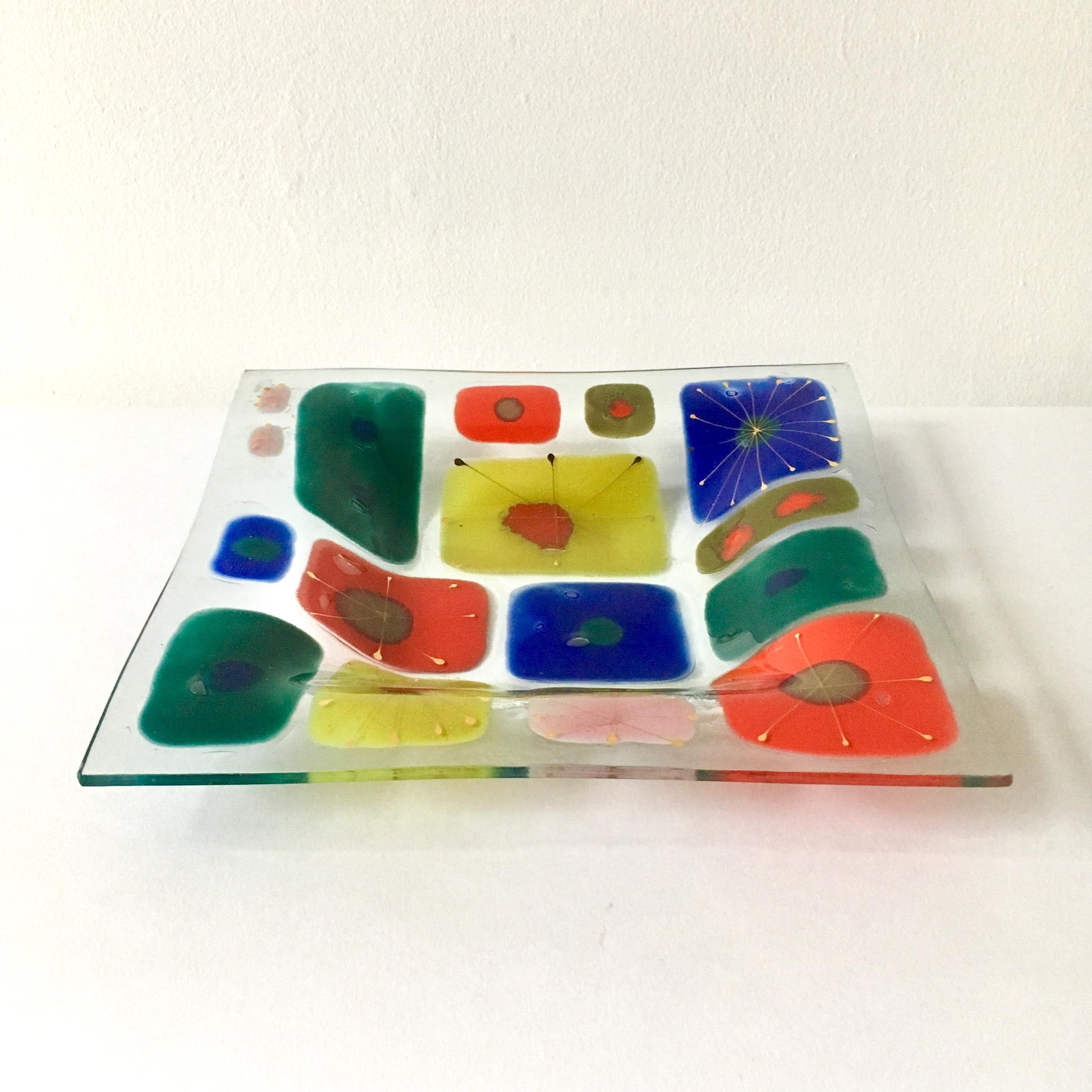 A large wells street studio coral fused art glass plate designed by Michael and Frances Higgins etched signature and dancing man 1951-1957.

Michael Higgins (1908-1999) and Frances Higgins(1912-2004) met in Chicago and were married in 1948. They