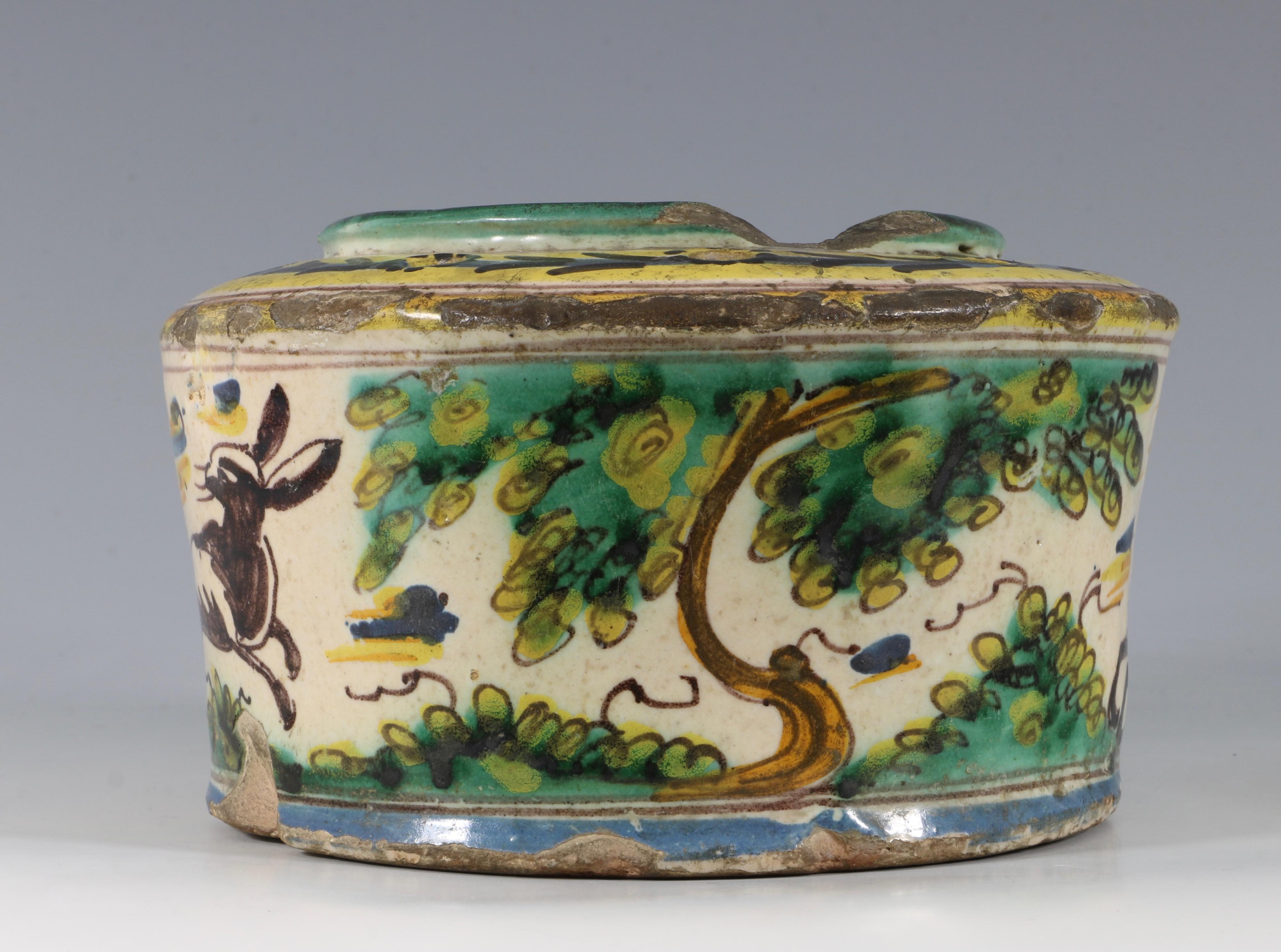 A large Talevera inkwell. The cylindrical vessel decorated with rabbits in a rural setting.

Talevera, 17th-18th century.