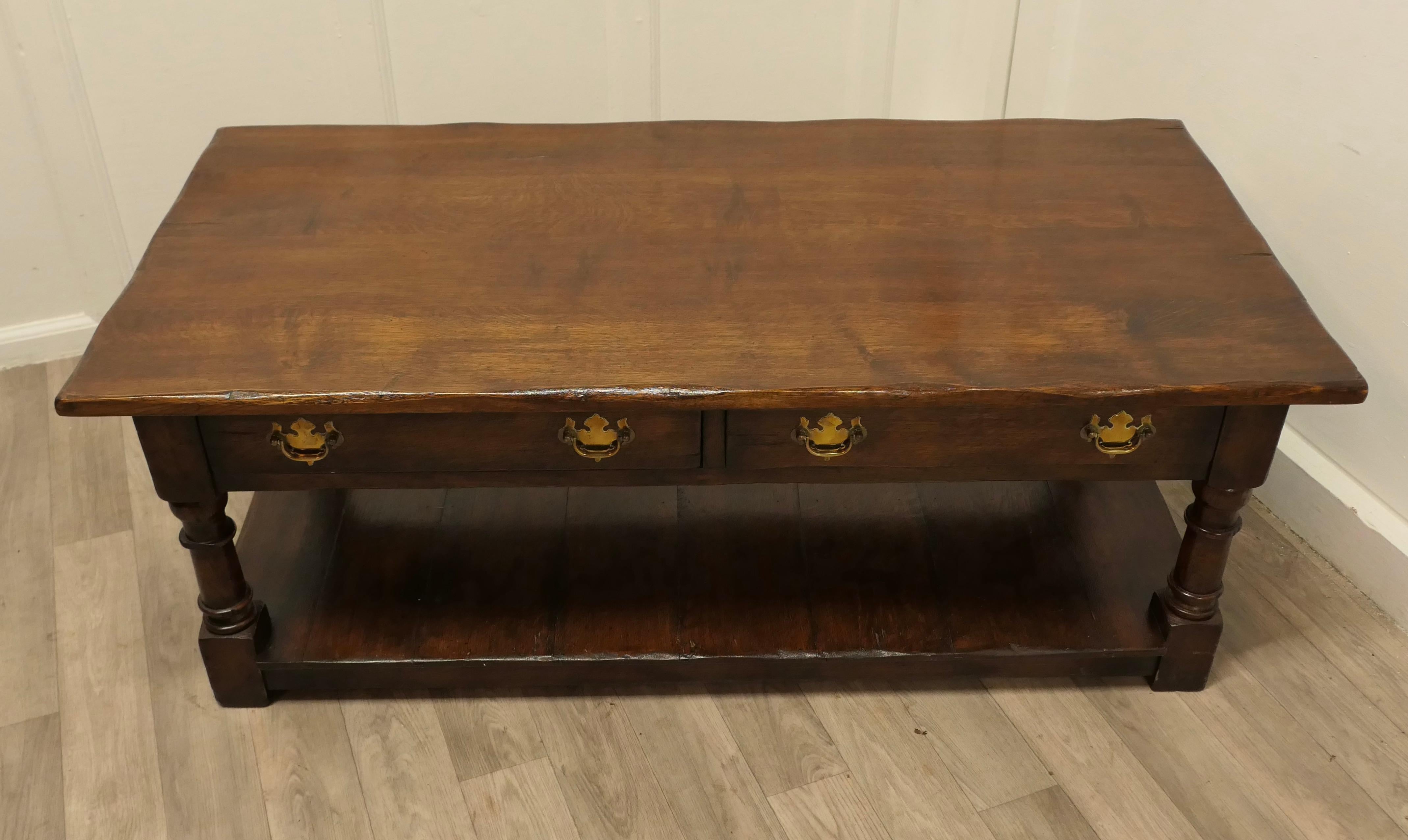 A Large Traditionally Made Oak Plank Top Coffee Table

This classic type of table has been very popular for many years, it gives the use of a good sized decorative piece
The table is made in solid Oak, the table has a planked top, 2 drawers to one
