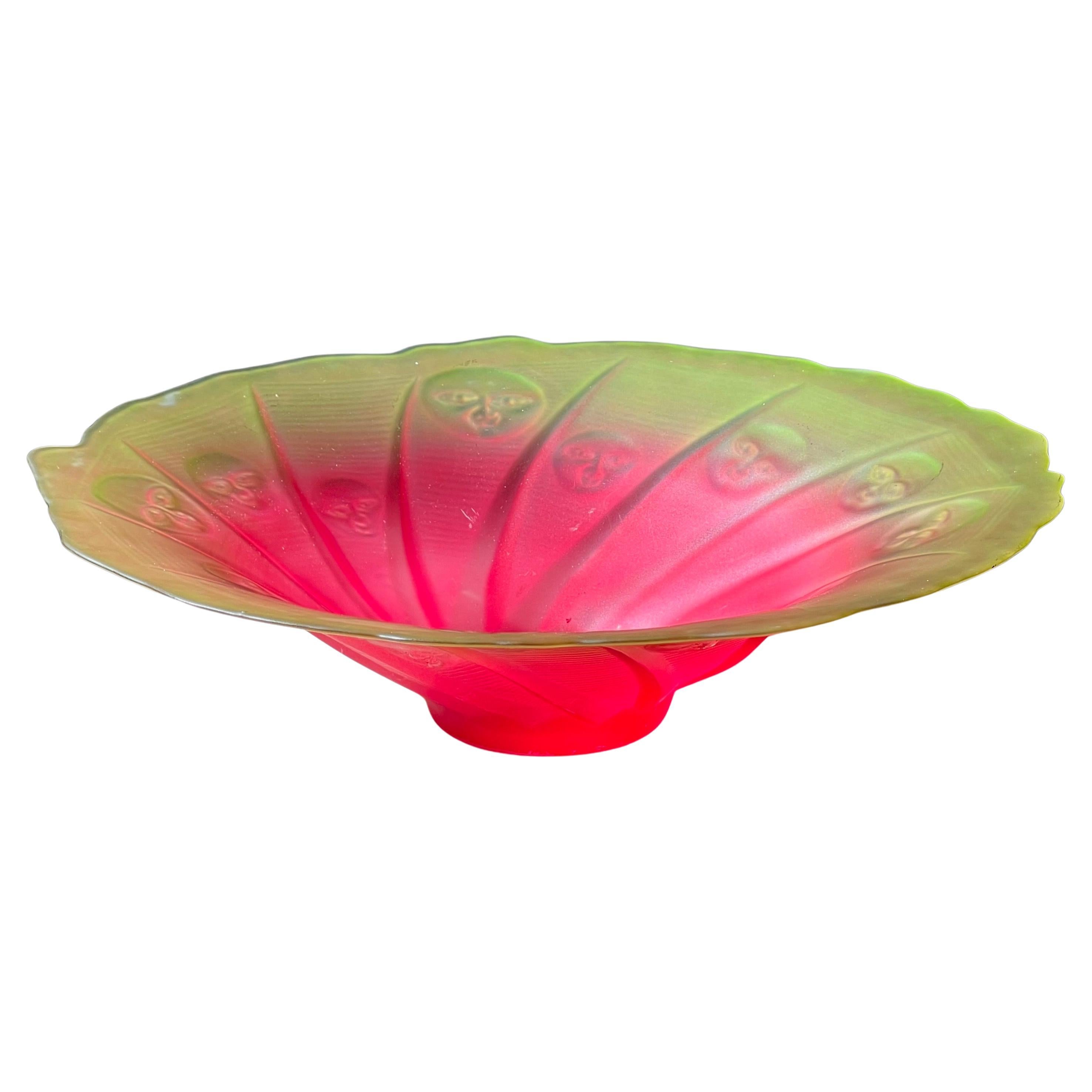 A large unique depression glass platter with moon faces, early 20th century