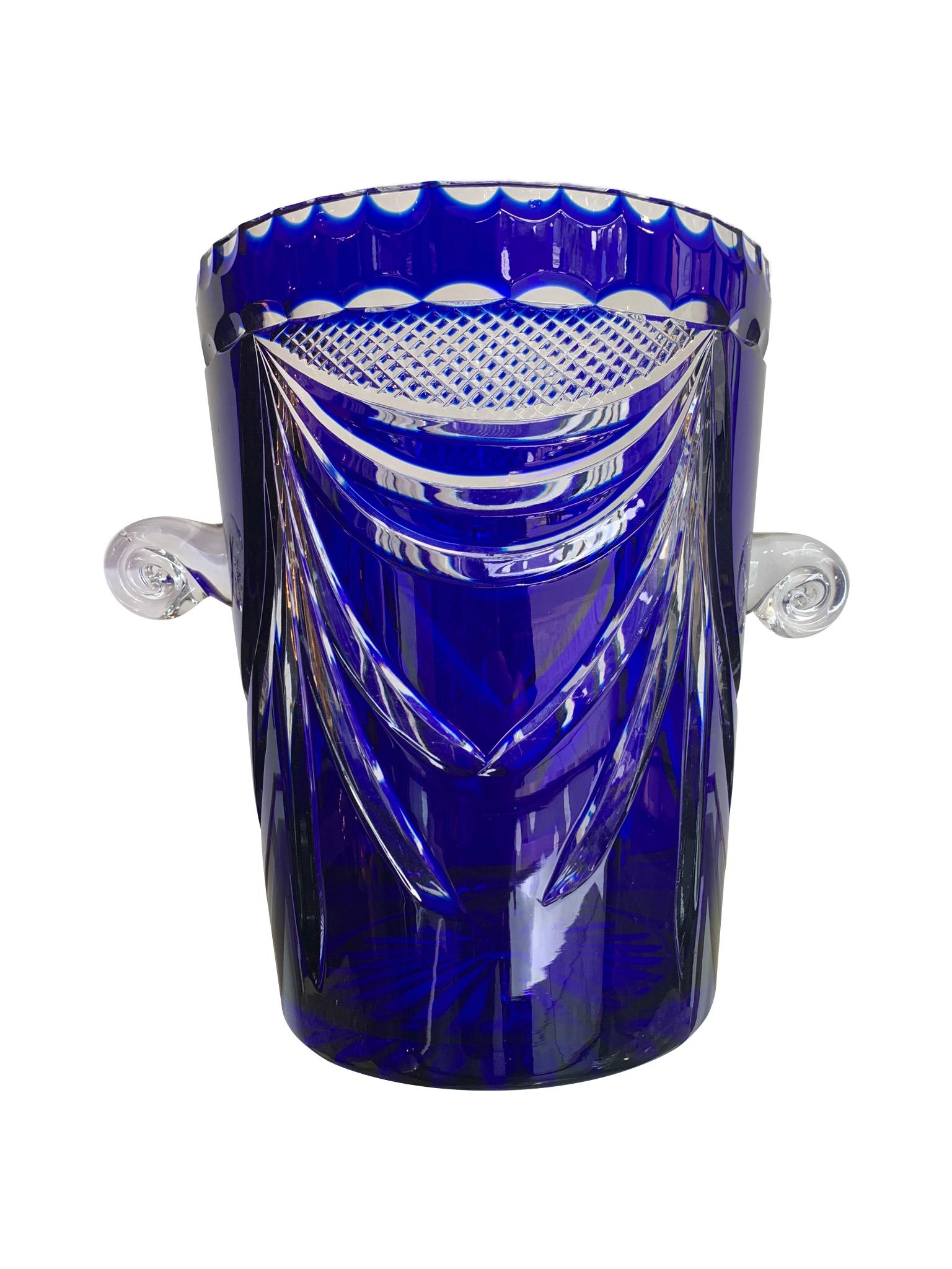 A large Val St Lambert cobalt blue cut crystal champagne bucket with clear glass swirling handles.