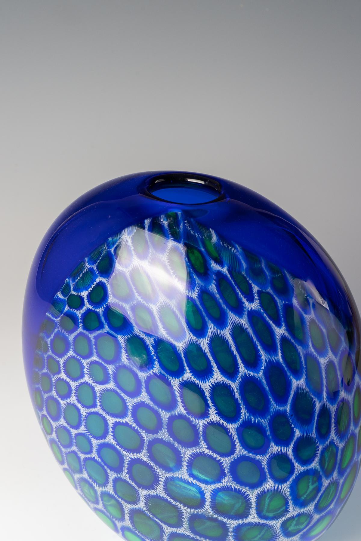 A large vase Seguso Viro, Murano, designed by Giampaolo Seguso, 1993, copy no. 89 of 99.

Dimensions
H 30.4 cm.

Medium
Oviform vessel of thick clear glass with blue, green, 'a merletto' filigree and white inclusions.

Excellent condition, signed