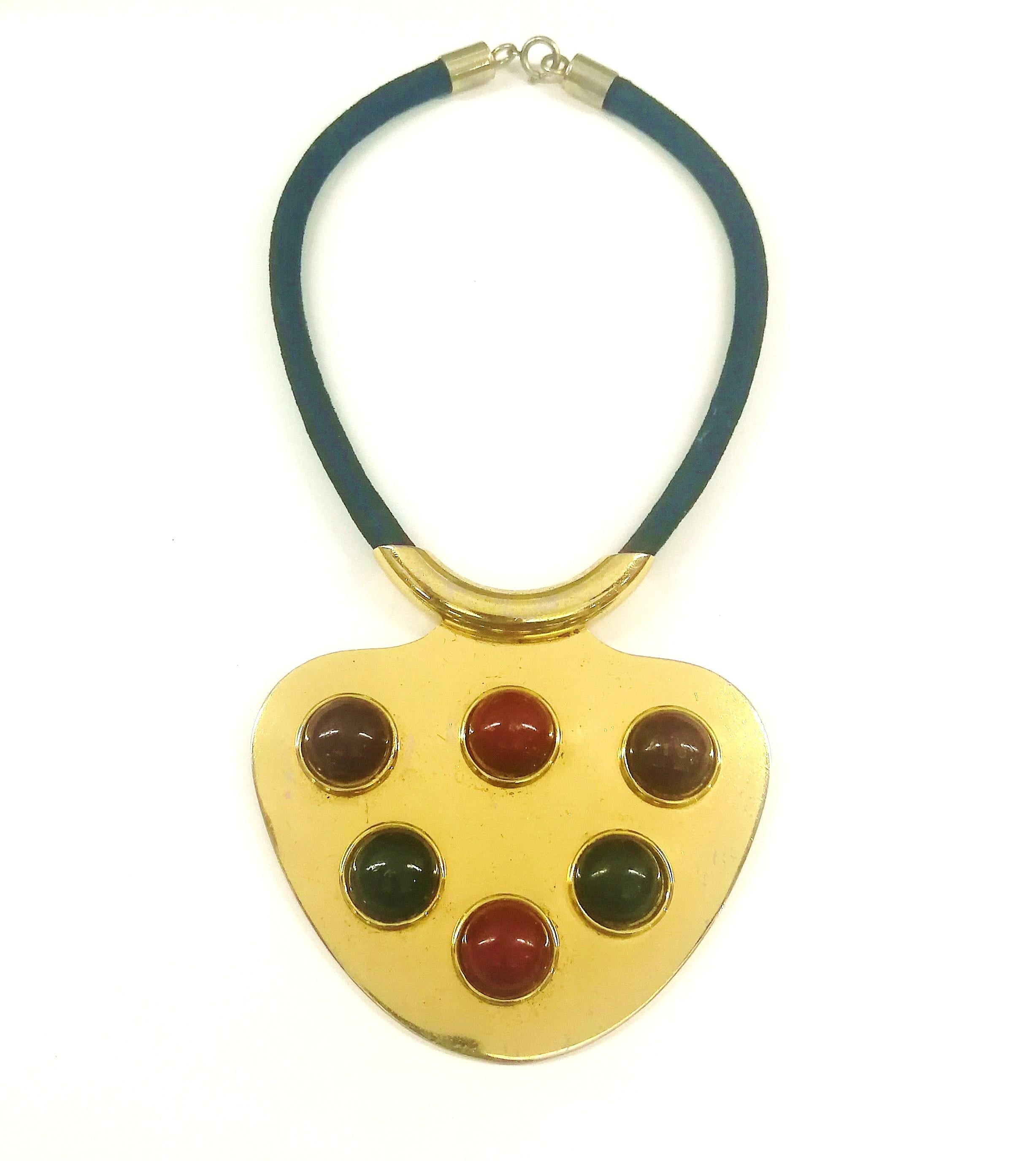 A striking gilded metal and coloured Bakelite cabuchon pendant by Lanvin from 1970. At a time when fashion was pushing ahead into Space Age designs and ways of living, Lanvin too were at the forefront of presenting highly futuristic, abstract