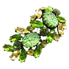 A large vibrant green paste 'lava' stone brooch, Elsa Schiaparelli, USA, c1954.