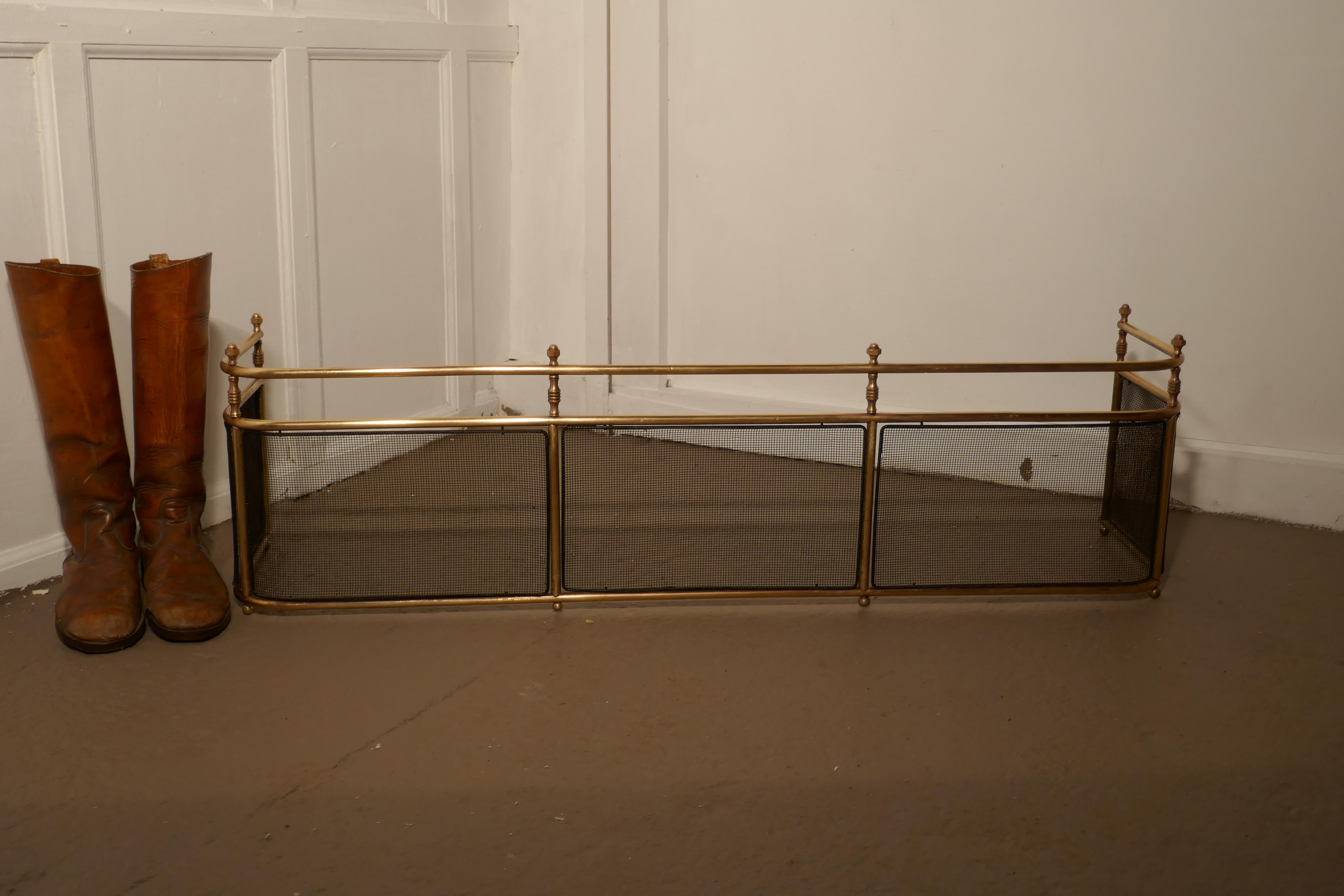 A large Victorian brass club fender

This is a Victorian antique Club Fender often known as a nursery guard as it completely surrounds the fire. 
This Fender is top quality and very heavy it is made in solid brass, the fender has wire mesh panels