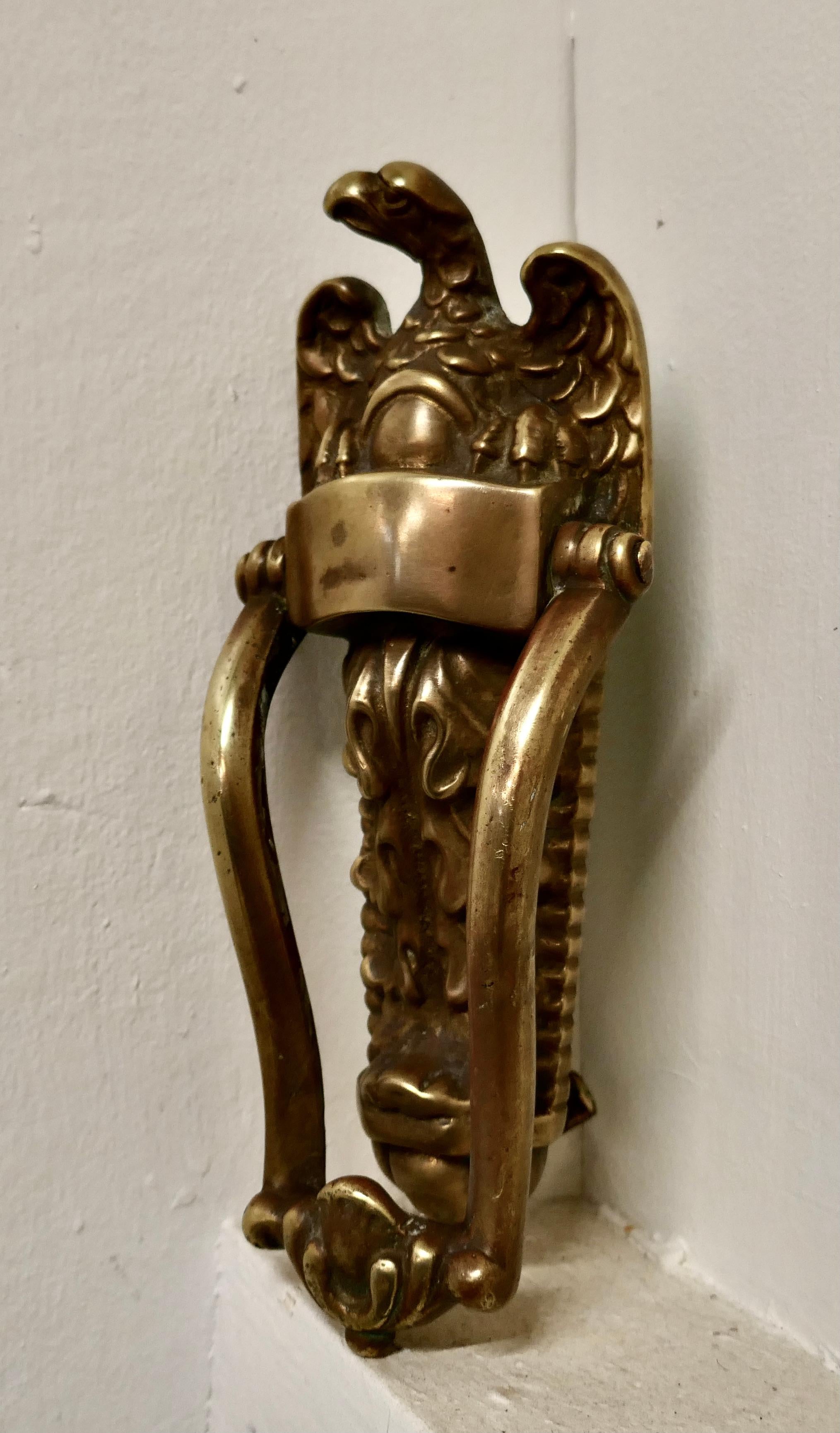 A large Victorian brass eagle door knocker,

A large Victorian brass eagle door knocker, the eagle is looking left, and perched on acanthus leaves, the fittings are all good to reuse
The door knocker measures 9” high x 4” wide and 2” deep
GB345.