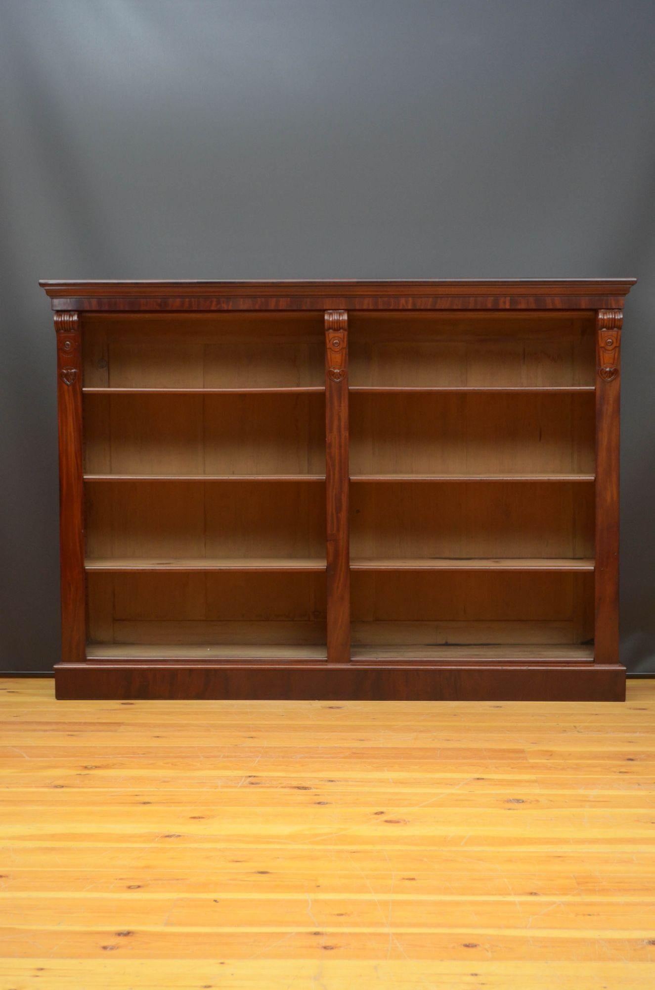 Sn5377 Fine quality large Victorian mahogany bookcase, having figured mahogany top above shallow frieze and two open sections with height adjustable shelves, all flanked by fine quality drop carvings, standing on moulded plinth base. This antique