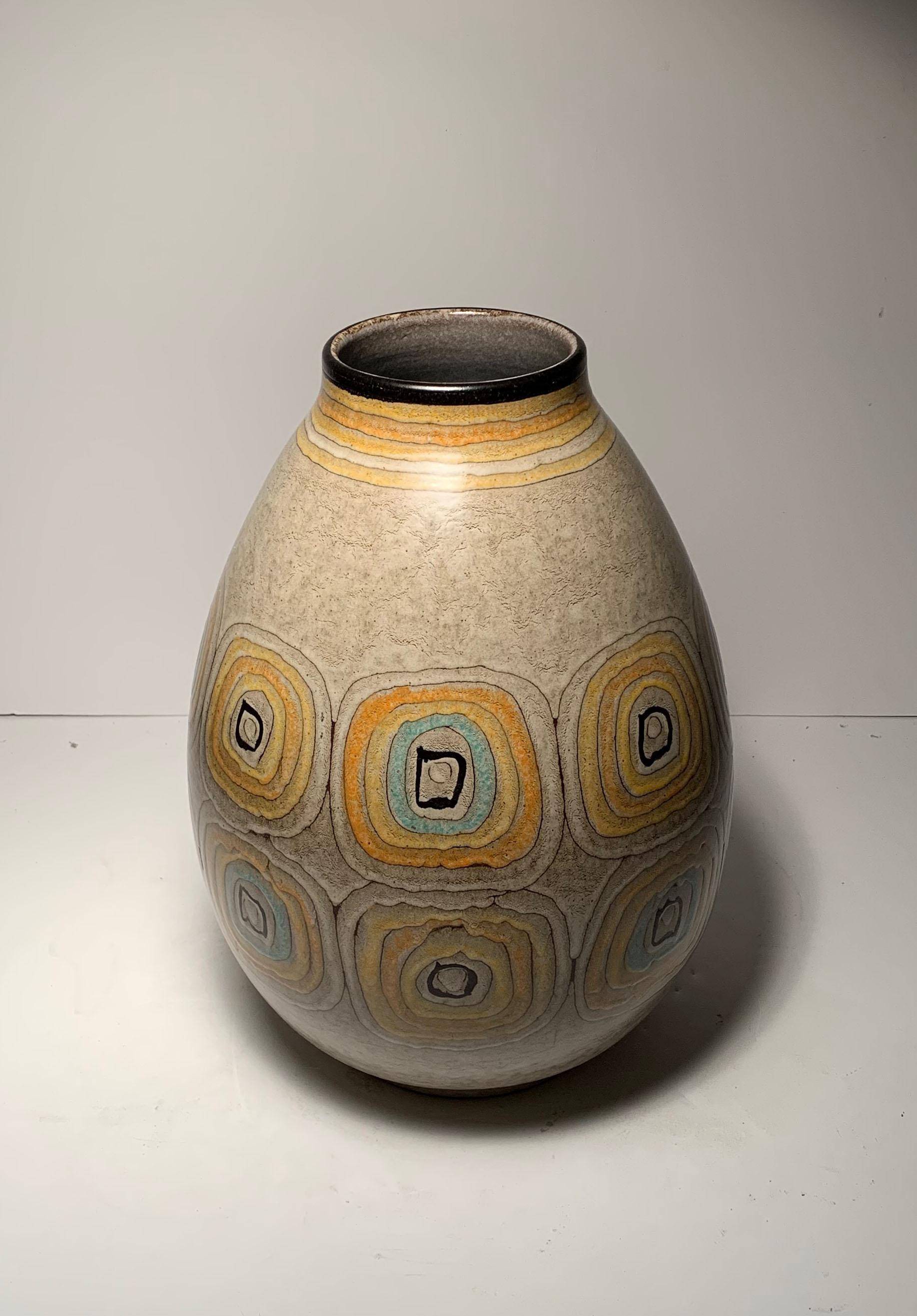 A large Alvino Bagne signed ceramic vase. Probably imported through Raymor. This an unusually large form. Style of Aldo Londi Bitossi, Fantoni

One chip at base of foot. Very difficult to notice, in less looking from the bottom. A simple restoration