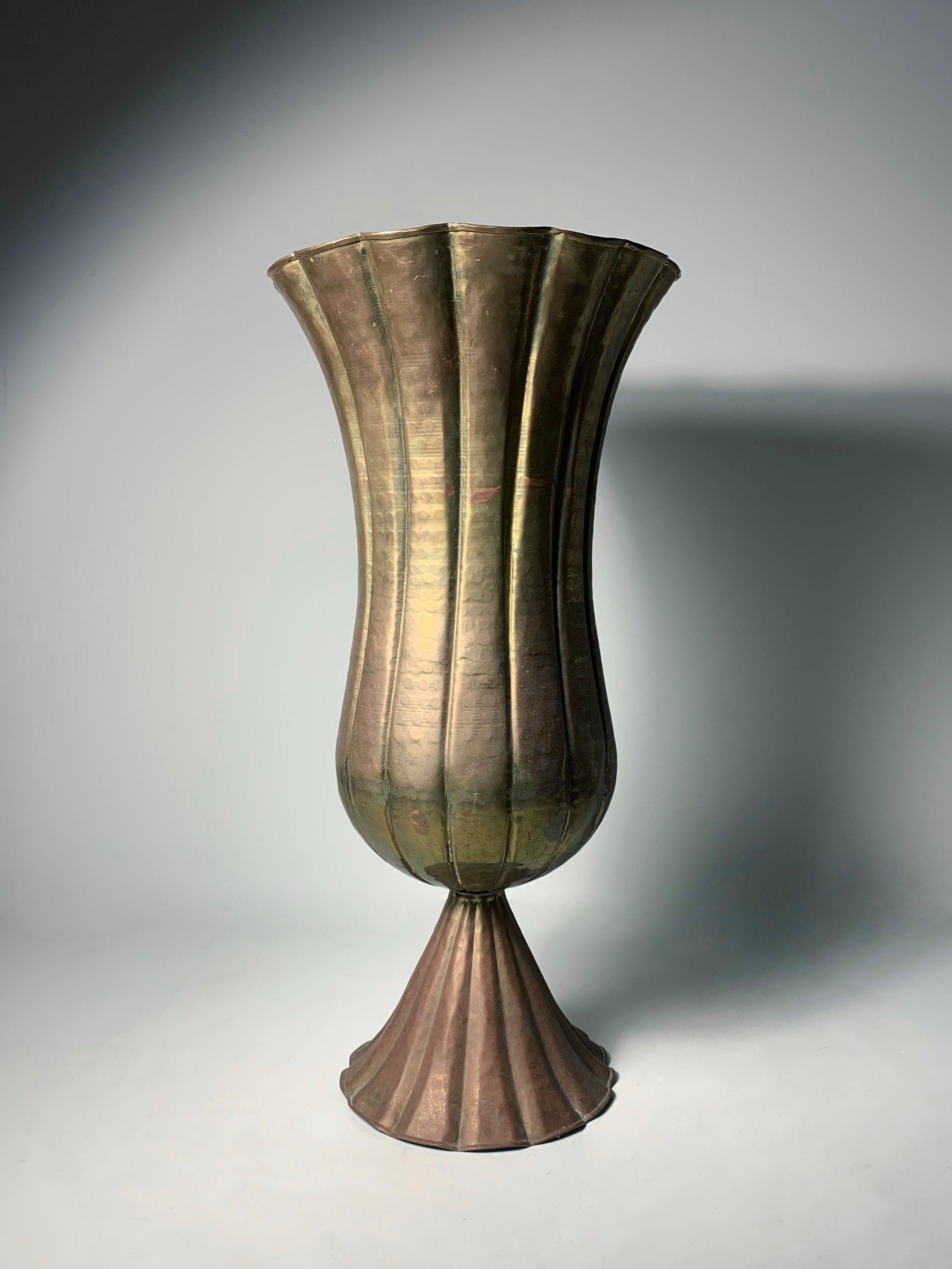A Large Vintage Handmade Hammered Brass Planter vase. 

It is signed Silvestri on base. Family run business on the West Coast that executed fine garden elements and also imported merchandise from around the world to compliment their store. This