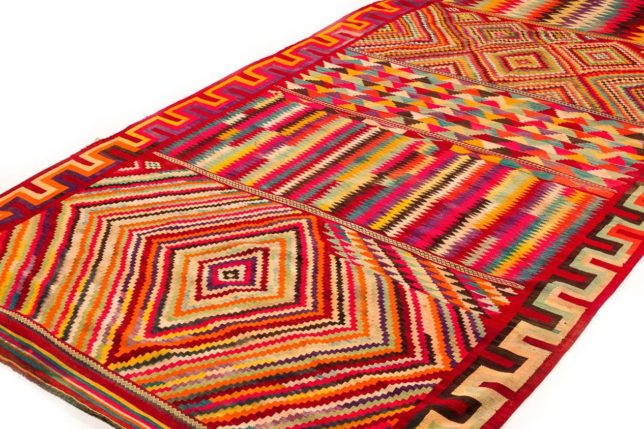 An incredible eye dazzler of a Kilim. This Algerian Kilim represents a rare type. The colors and pattern are breathtaking. Woven from excellent native wool.