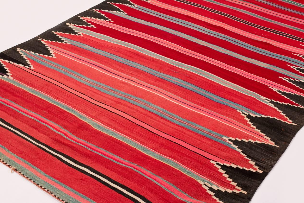A beautifully colored Kilim from Algeria probably woven in the 1950s. Very nice strong weave.  Measures: 6'1