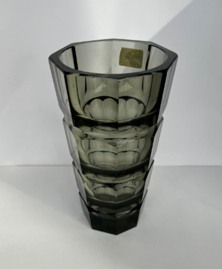 Art Déco Moser crystal glass vase from Czechoslovakia, Bohemia the 1930s. Design by Josef Hoffmann for Moser in Karlsbad. Anthracite or smokey topaz crystal glass with bold panel cut facets, luxurious with 8-facets polished, heavy implementation,
