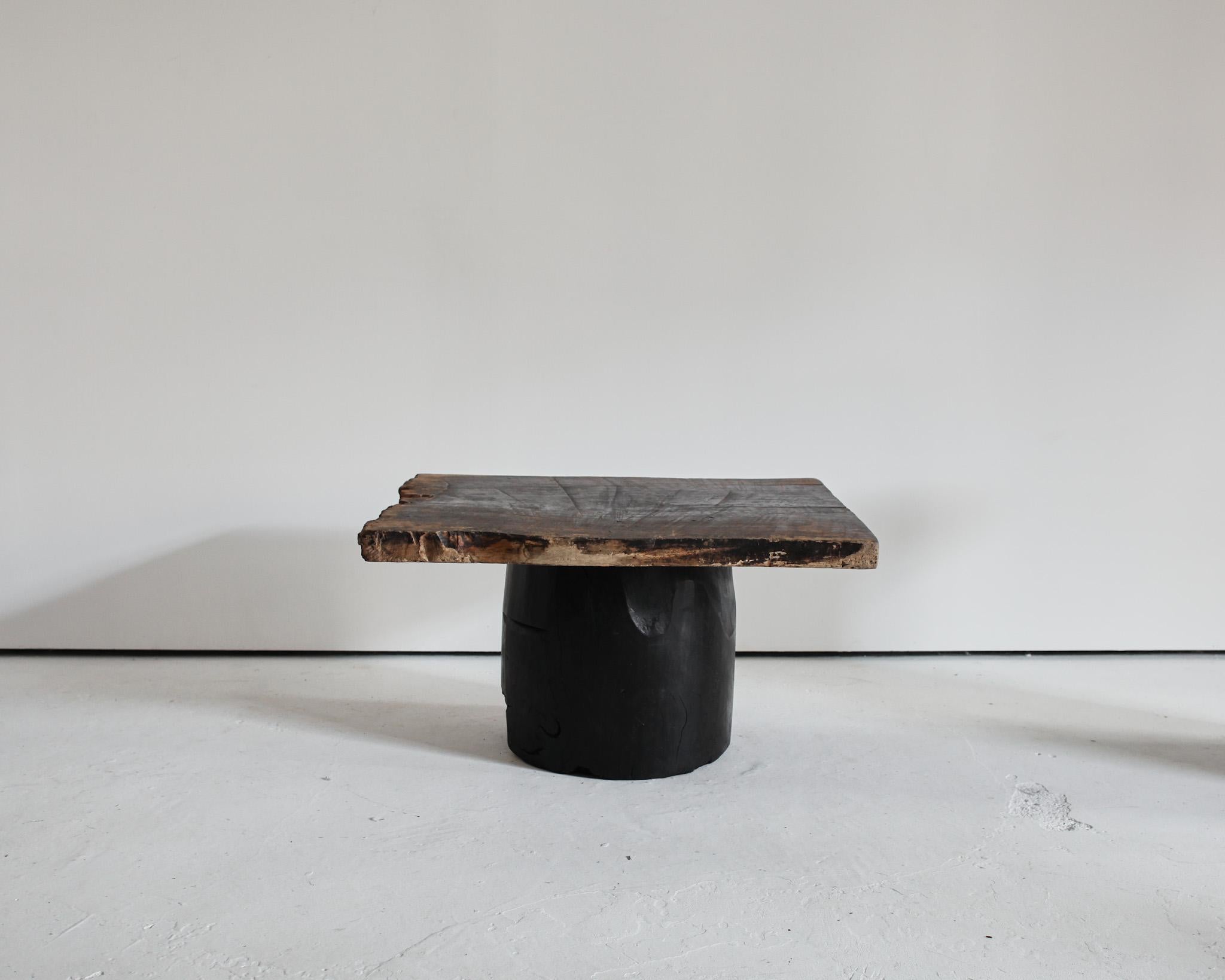 A unique, large dug-out Japanese coffee table.

Heavily patinated thick cedar top on charred dug-out cedar base.

Made using 19th C. Japanese elements in our London workshop.

5cm thick top.