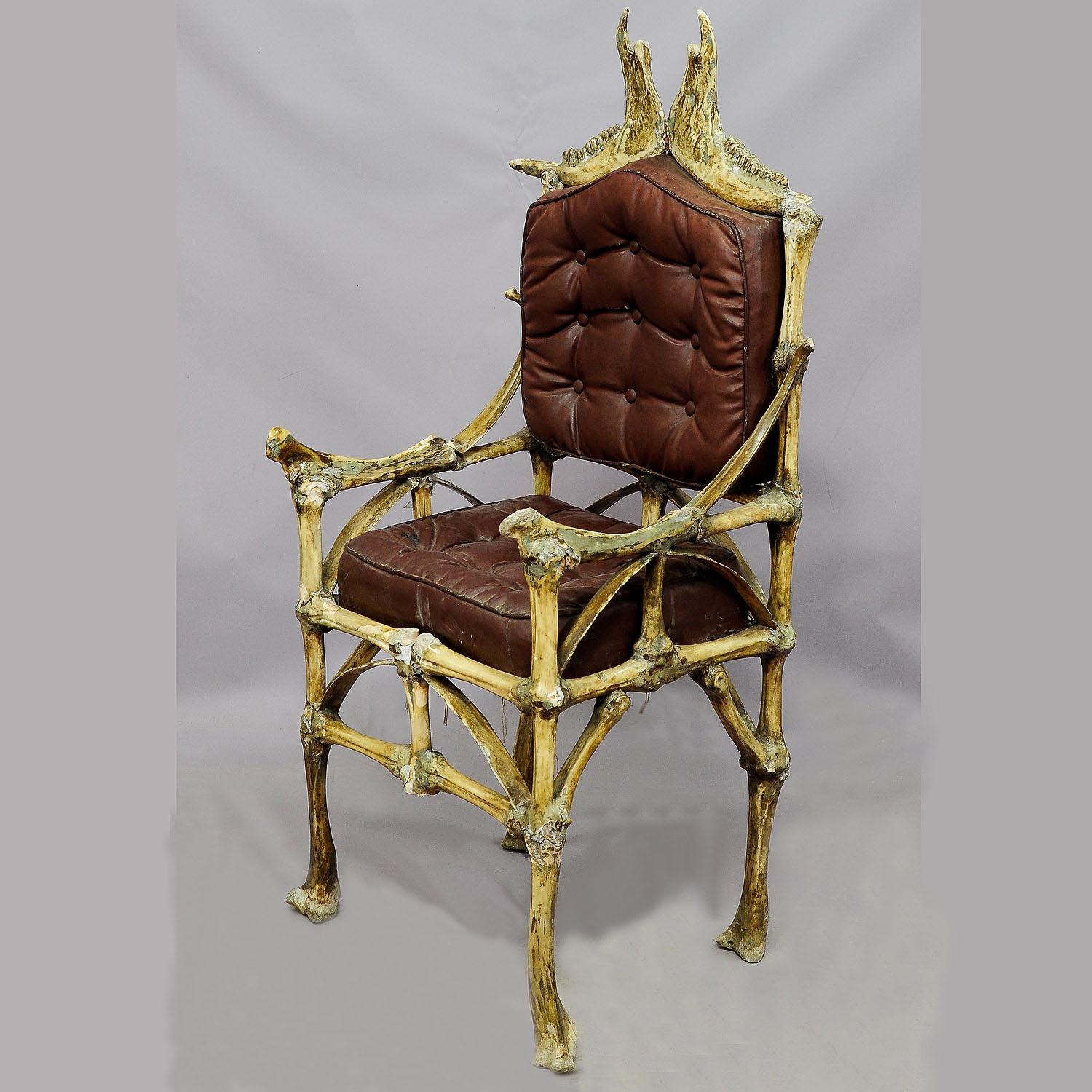 A great piece of fantasy furniture - a large throne chair made of original bones from the male cattle (Bos taurus). All parts are made of real ox bones sticked together with iron rods. On top of the backrest are underjaw bones. The chair is