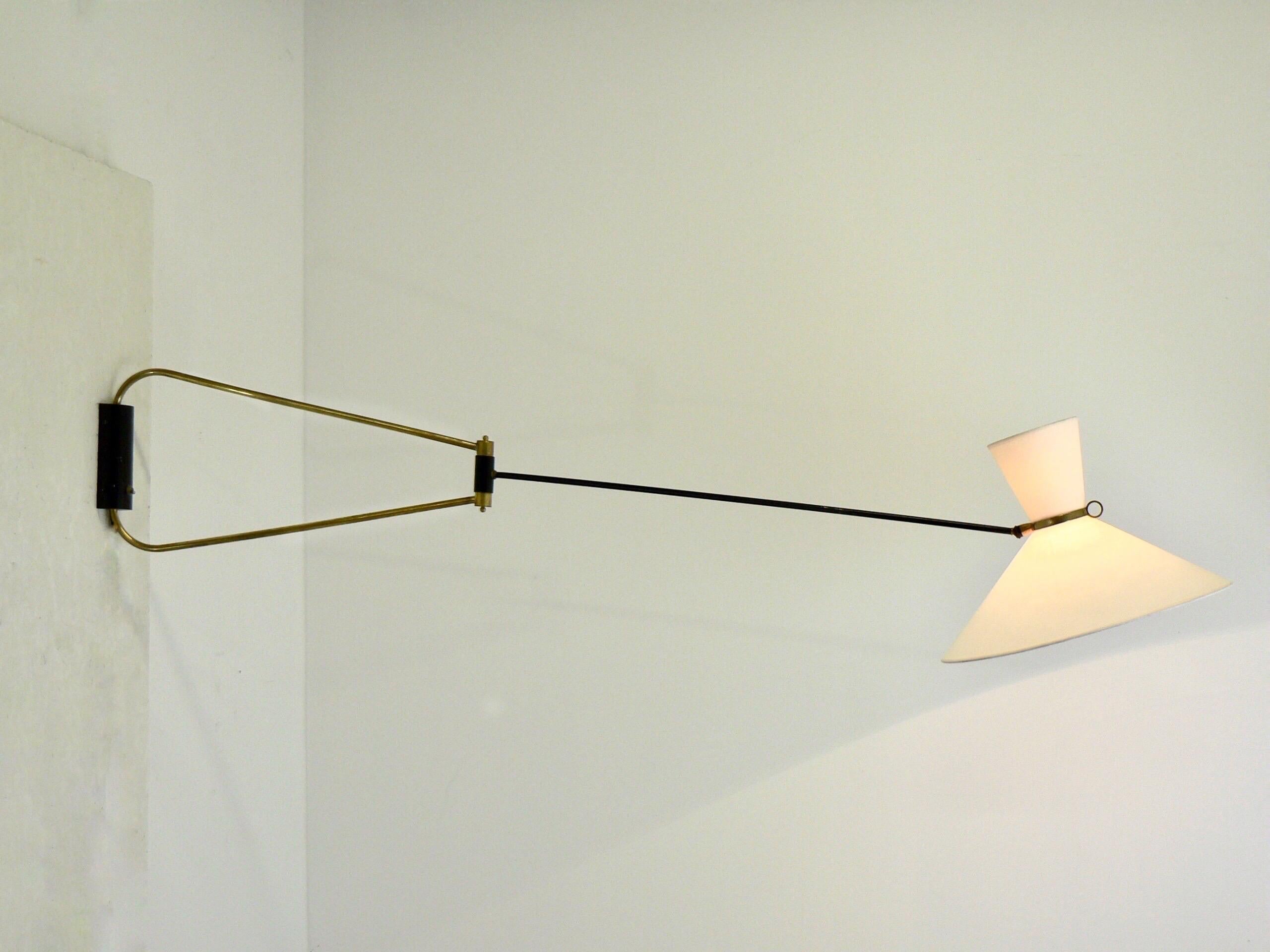 Robert Mathieu,
Foldable wall lamp.
Robert Mathieu Edition.

1952
Black lacquered metaln, gilded brass and fabric lamp shade.

Height: around 32 cm

Length max. 180 cm

Diameter with lamp shade: Around 45 cm

Good original condition, previously