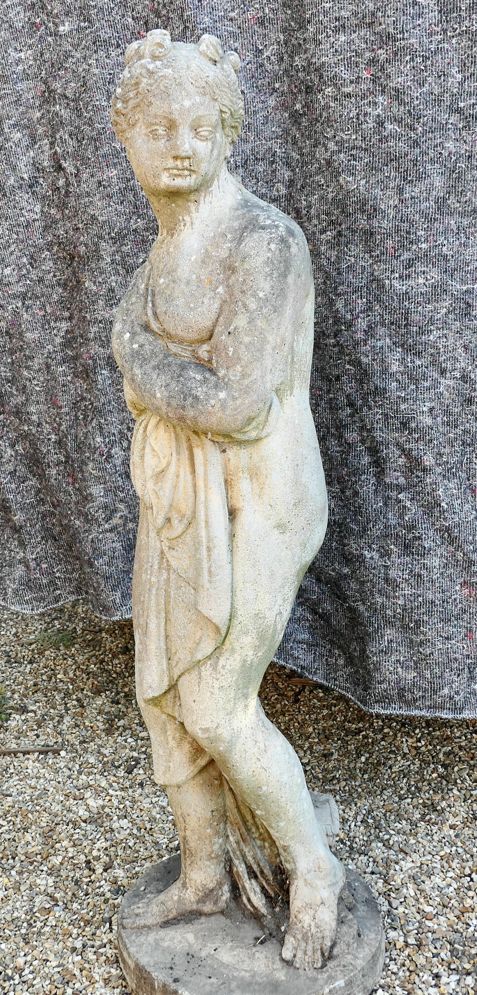 A large weathered Neoclassical statue of Pandora.

Large weather patinated neoclassical statue of Pandora with her box at her feet.
Our lovely girl is 4ft tall set on a 15” diameter base holding her clothes close to her
She has no damage or