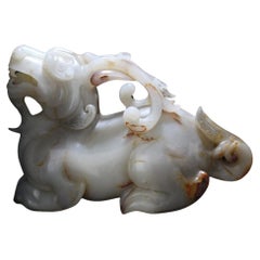Antique A Large White and Russet Jade Mythical Beast 