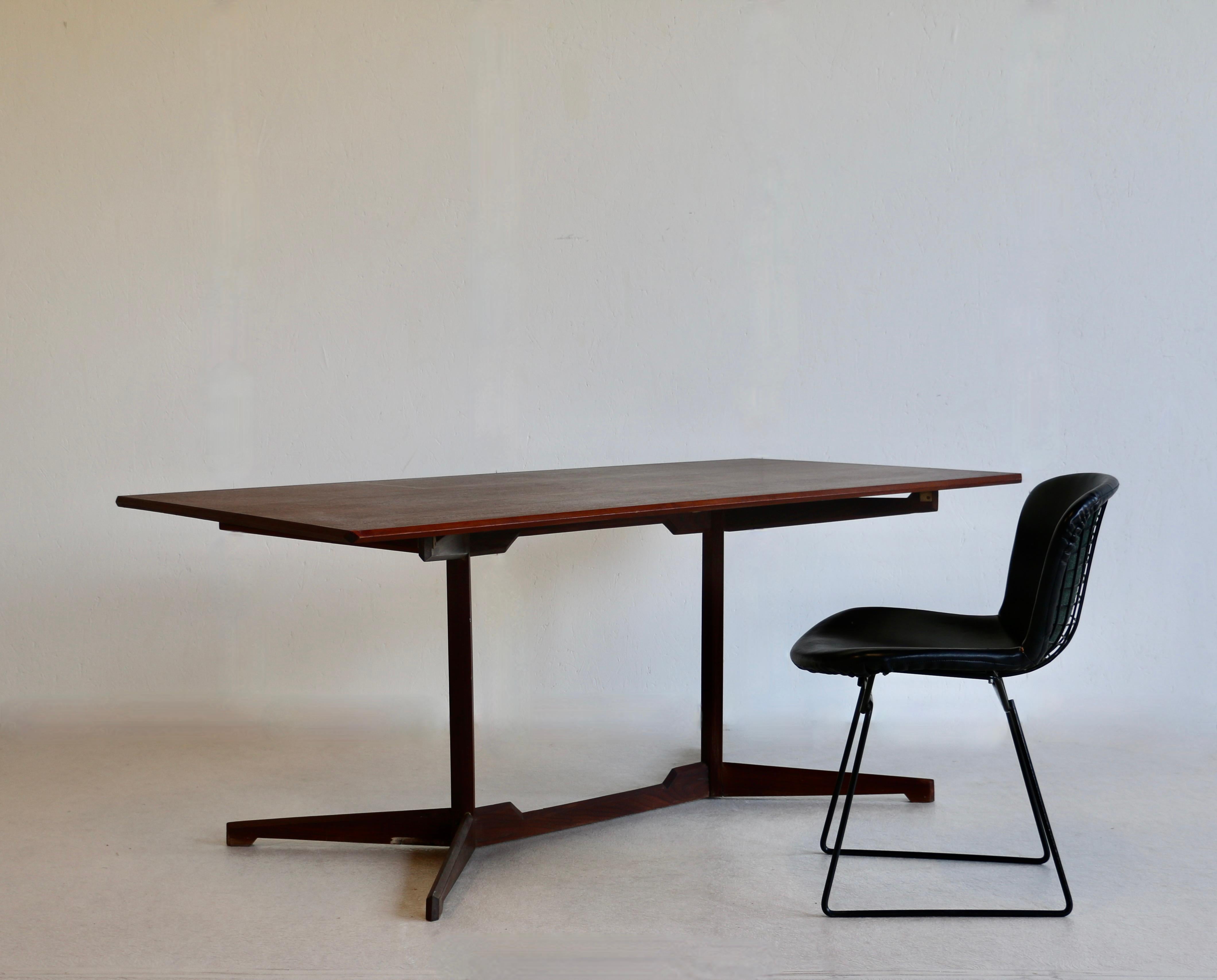 An attractive all-wood desk with oak veneer top and solid oak legs. Italian work, 70's.