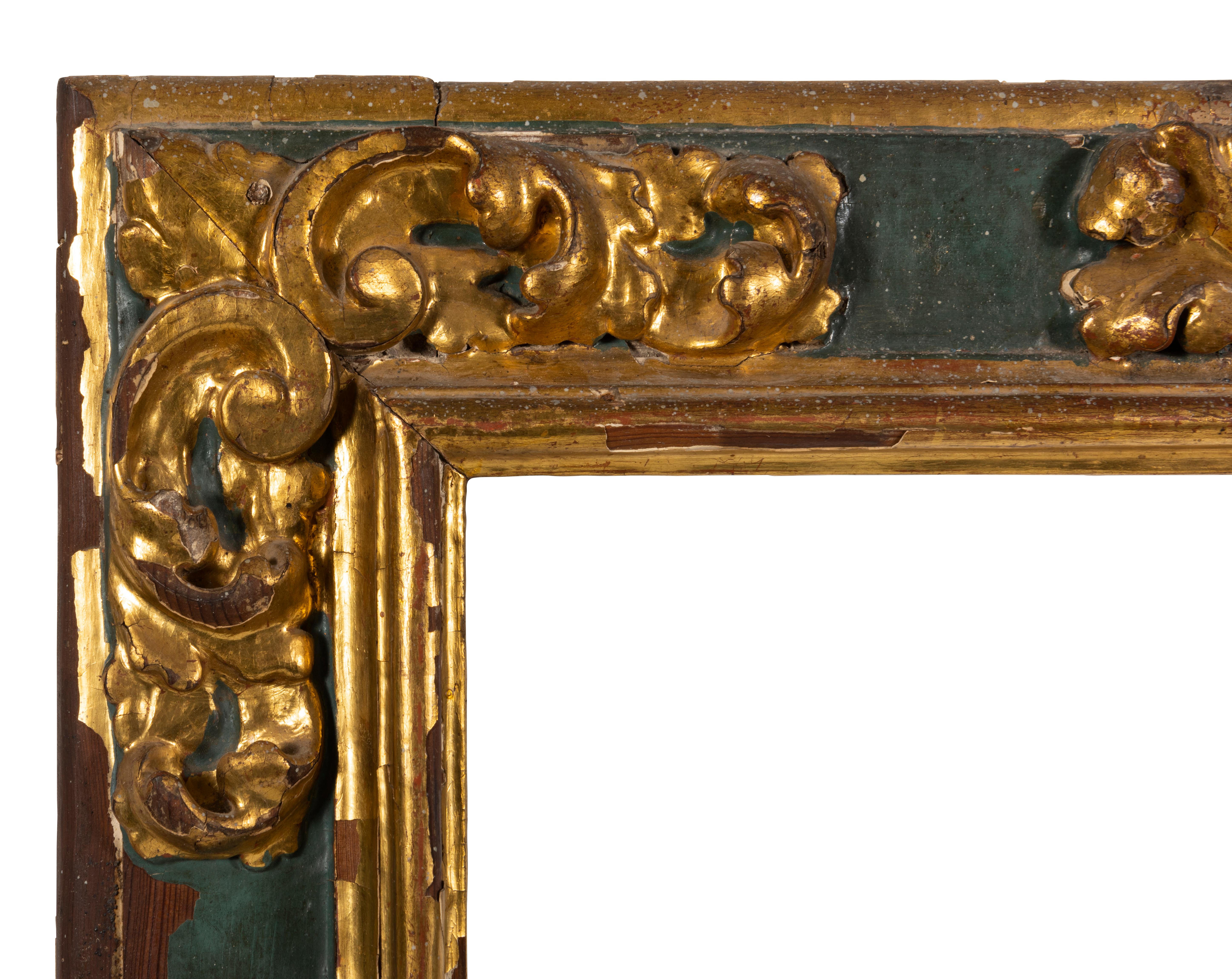 The finely carved green painted rectangular frame applied with gilt acanthus scroll moulding.
