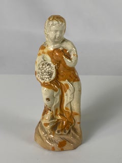 A Late 18th Century English Creamware Figure Representing Autumn