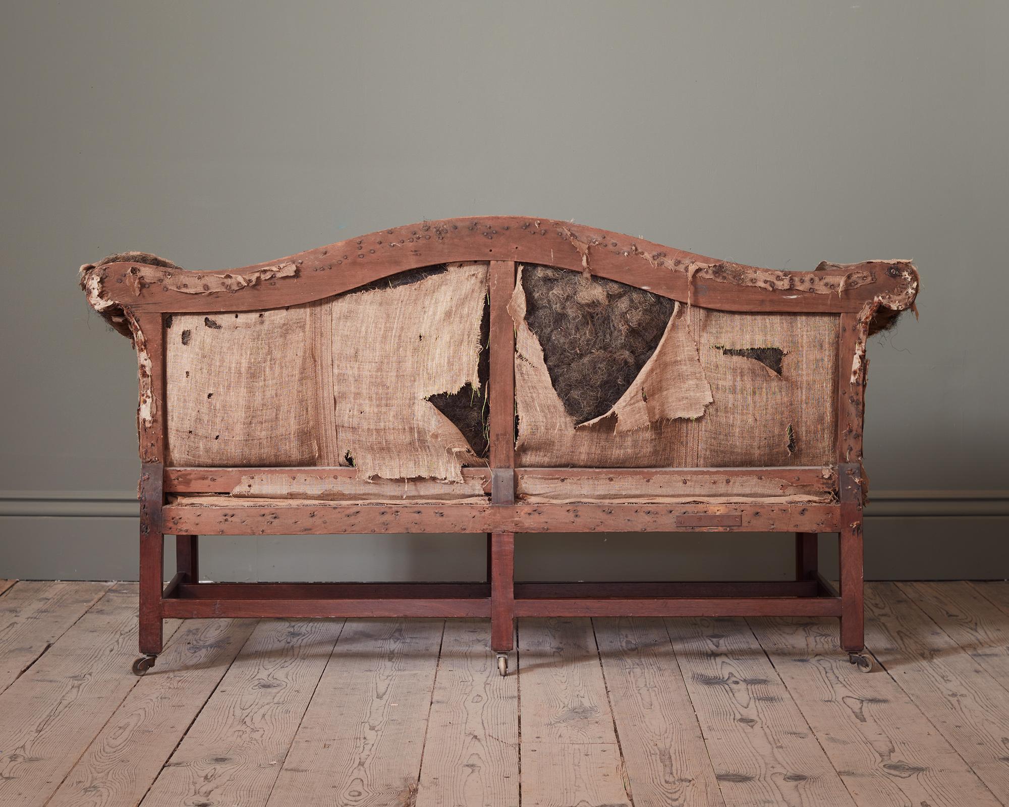 A Late 18th Century Mahogany Camel Back Sofa, of Smaller Proportions In Distressed Condition For Sale In London, GB