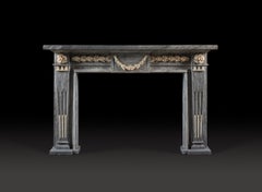 A Late 18th Century North Italian Chimneypiece, Carved in Bleu Turquin Marble