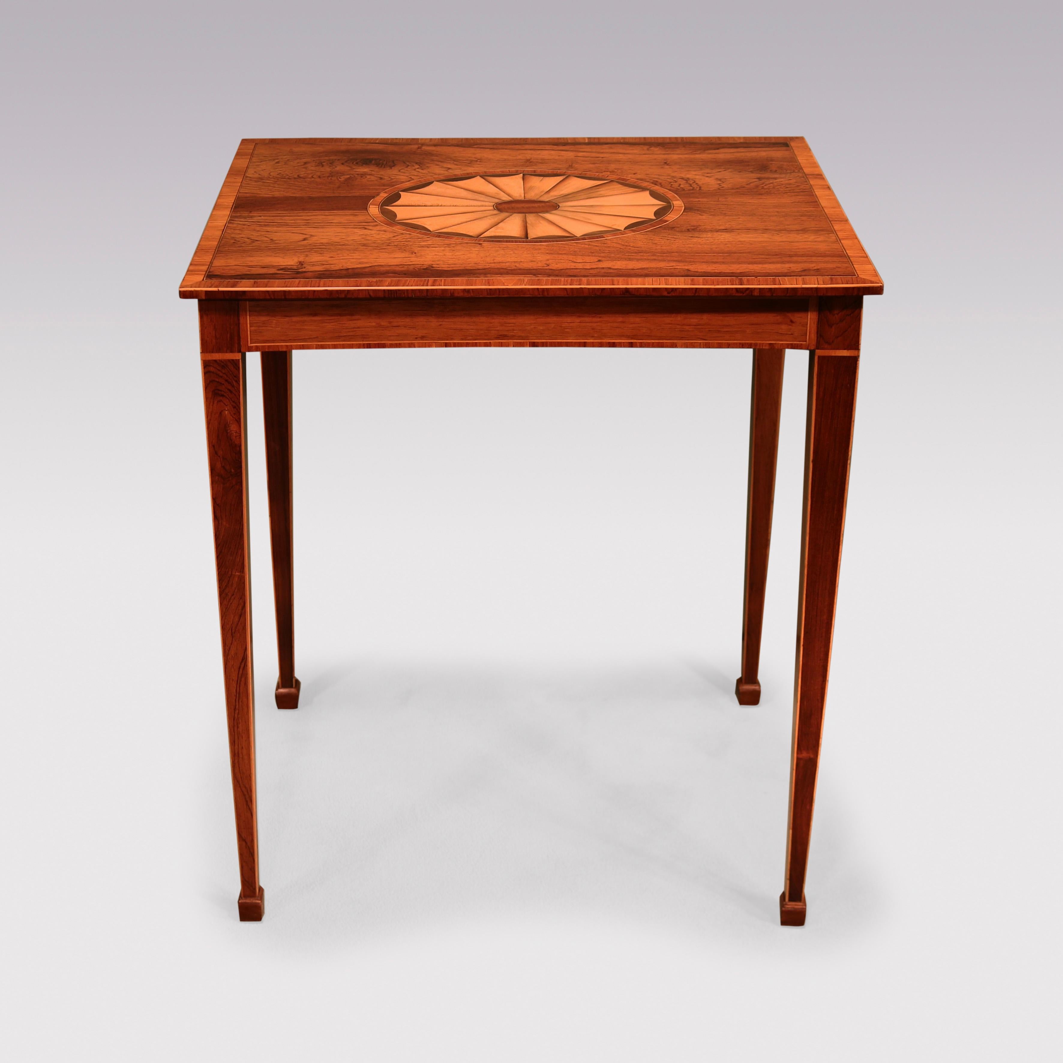A late 18th Century rosewood Occasional Table, boxwood string throughout, having tulipwood crossbanded rectangular top with central fan inlaid oval panel, supported on square tapering legs ending on block feet. (repairs to centre oval).