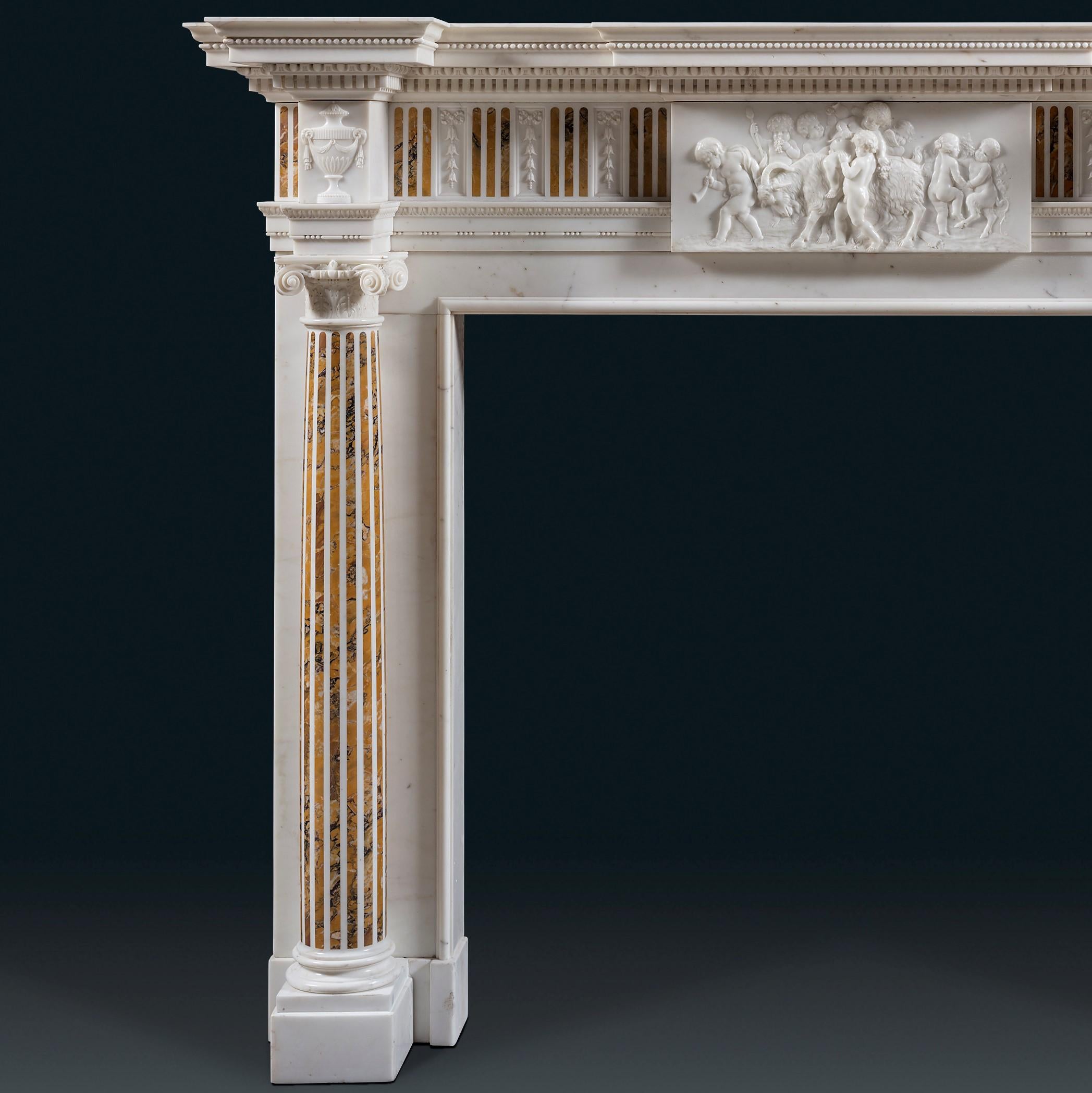 A late 18th century style chimneypiece in Statuary and Siena marbles of truly exceptional quality. The moulded shelf, carved with dentils and Egg & Dart, breaks forward above the central tablet and square corner blocks. The tablet depicts a scene of
