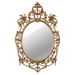 A Late 18th / Early 19th English Carved Oval Giltwood Salon Mirror