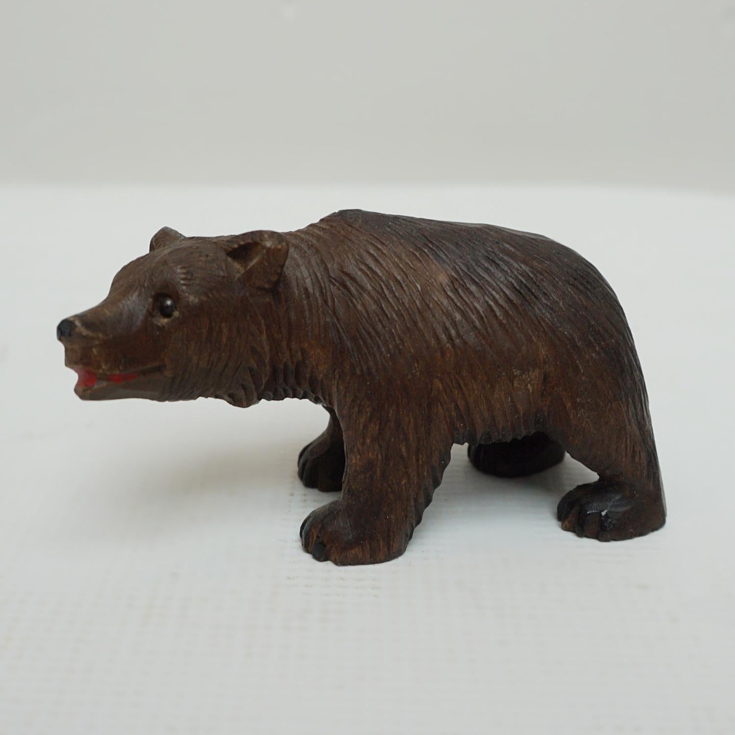 A Black Forest small carved baby bear. fine hand carved detail with original glass eyes. Linden wood.

Origin: Swiss

Date: circa 1900

Item Number: 1605231.