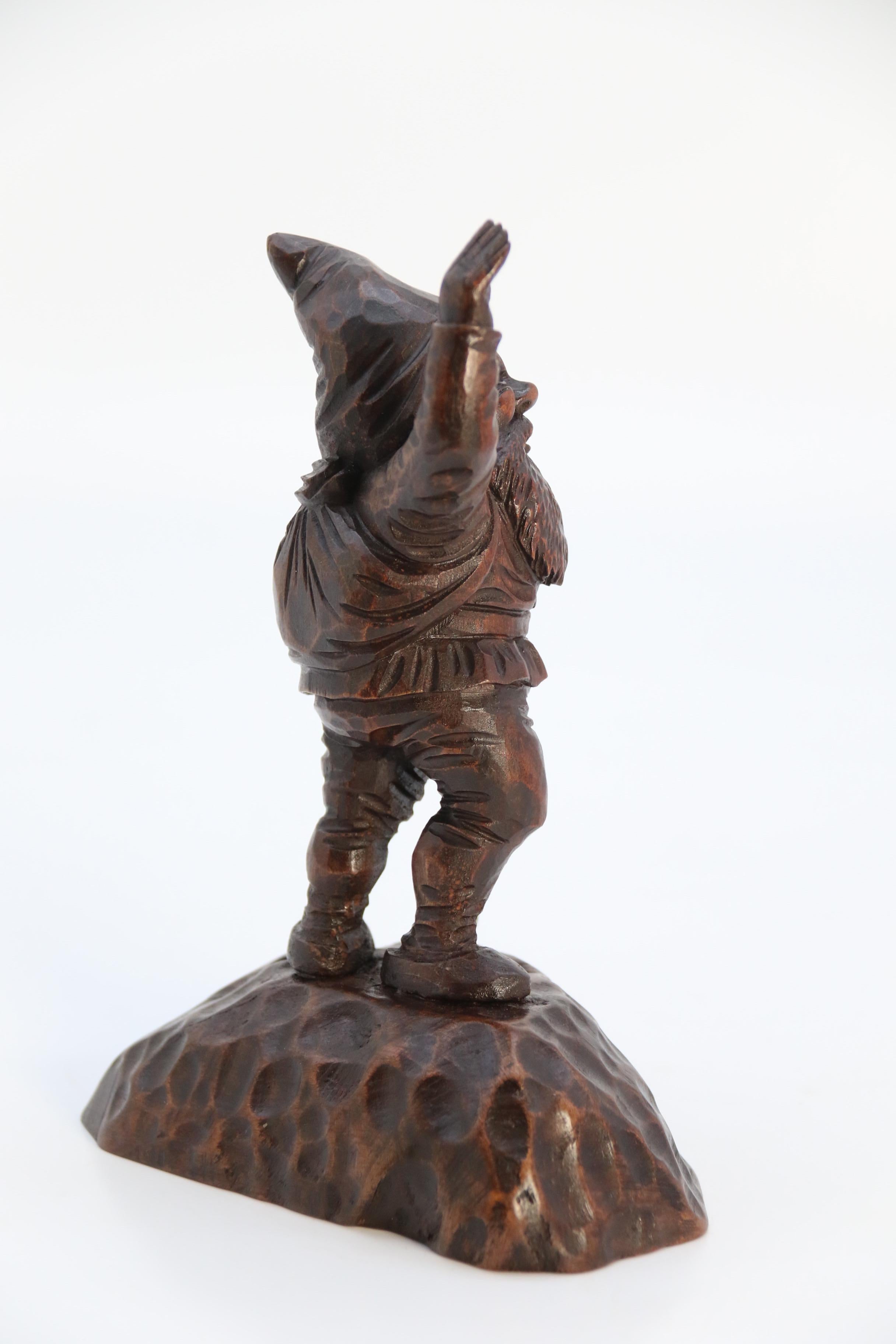 Carved A late 19th century Black Forest carved walnut figure of a gnome circa 1900