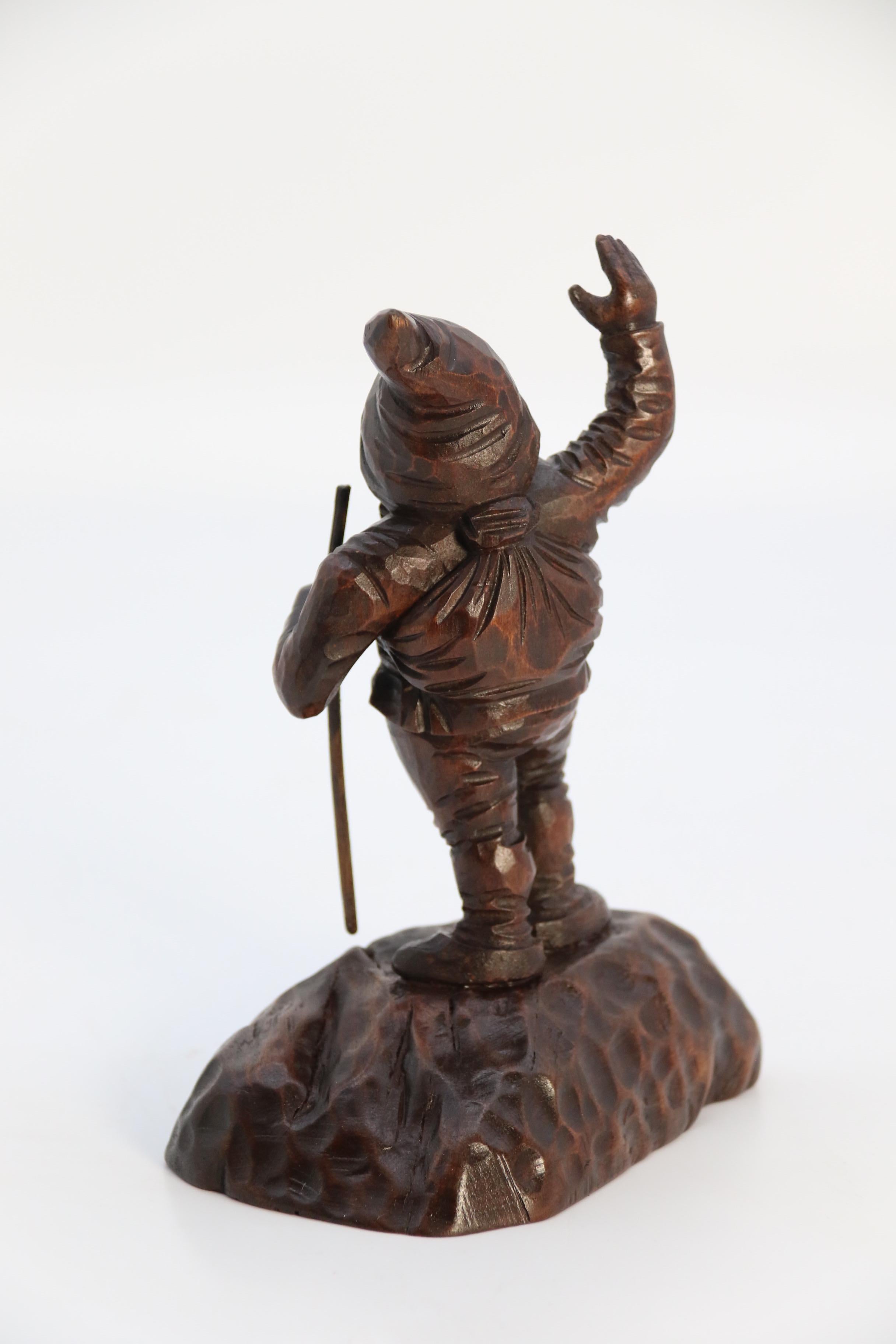 20th Century A late 19th century Black Forest carved walnut figure of a gnome circa 1900