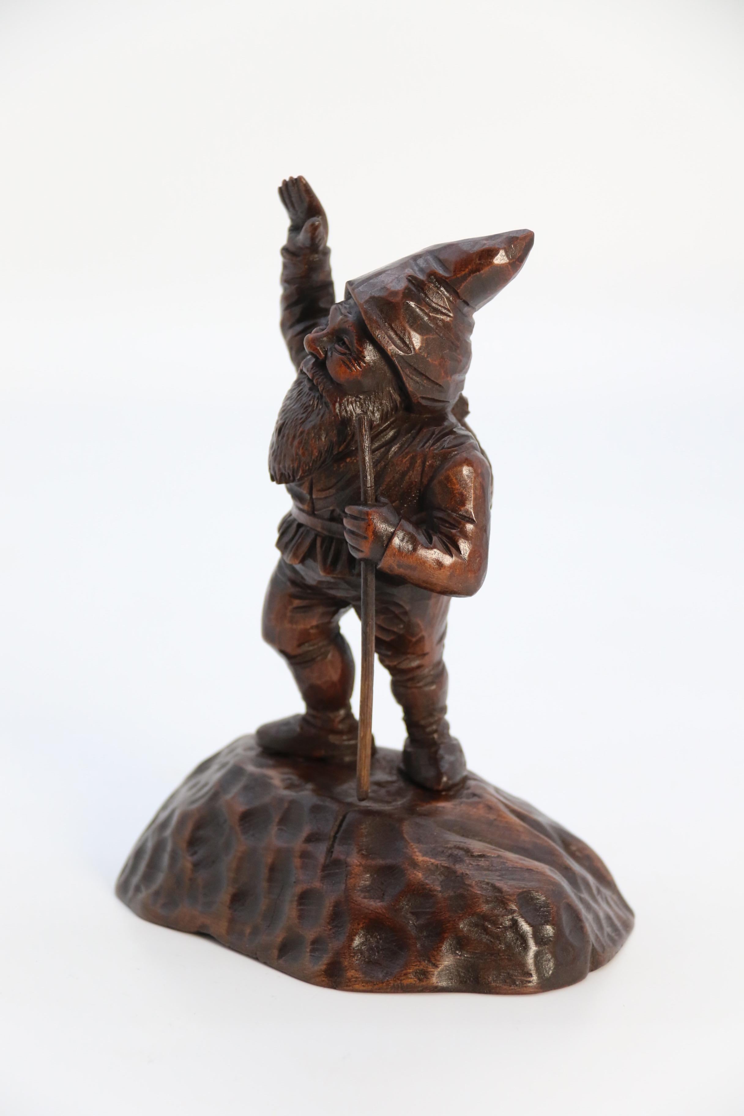 Walnut A late 19th century Black Forest carved walnut figure of a gnome circa 1900