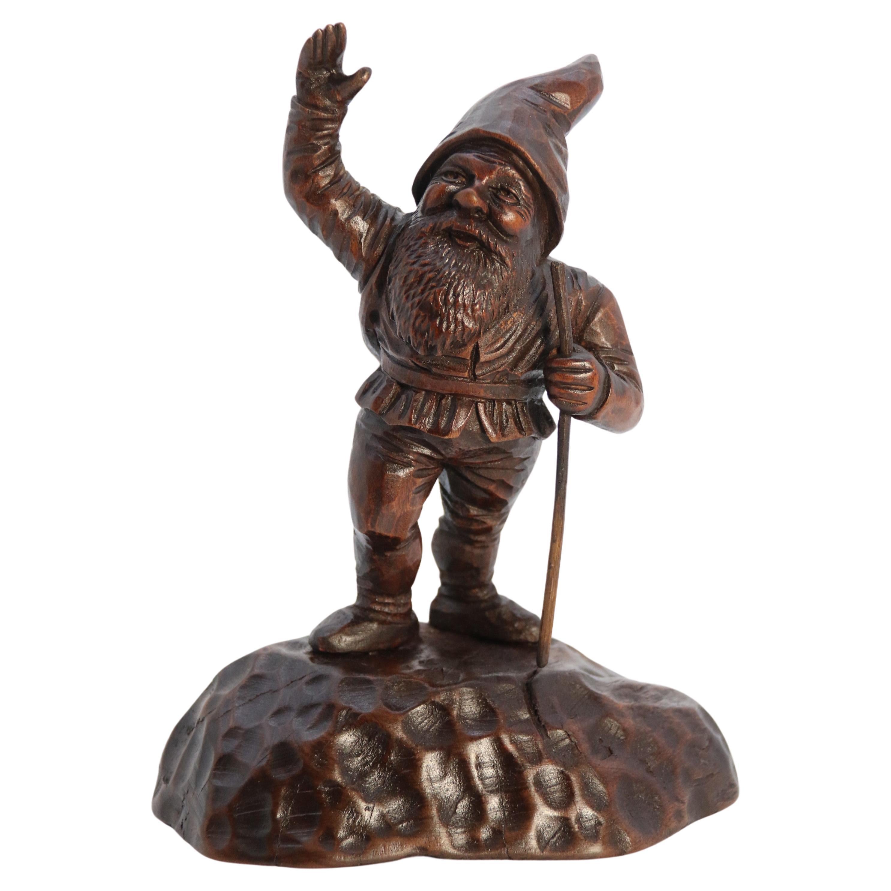 A late 19th century Black Forest carved walnut figure of a gnome circa 1900