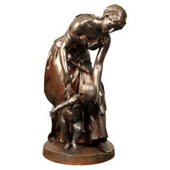 Sculpture en bronze de la fin du XIXe siècle intitulée Les Premiers Pas par Henri Plé