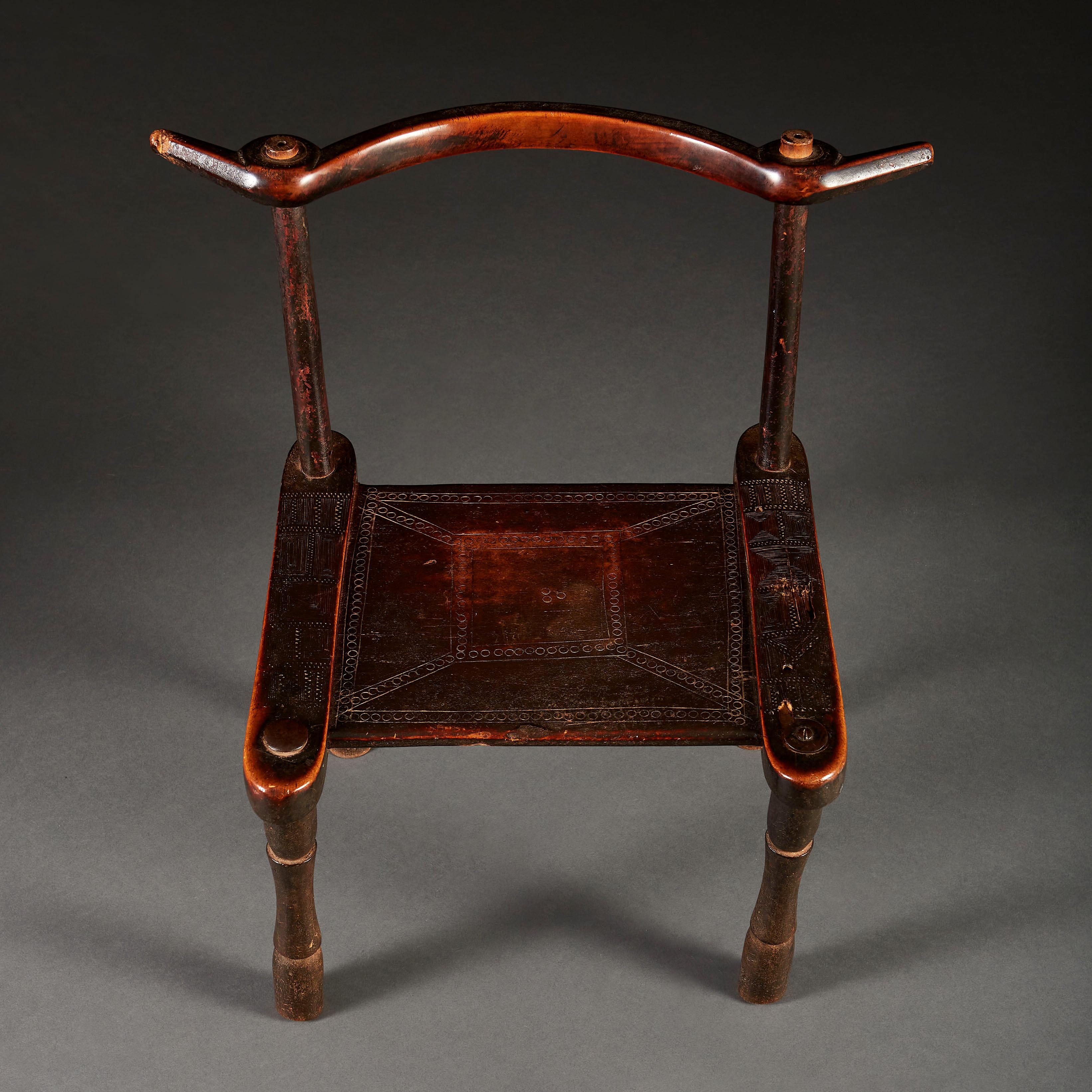 An important late nineteenth century Senufo chair from the Côte d’Ivoire, constructed from tropical hardwood, with curved back splat and carved seat. Of small scale.

Provenance: Private collection, London, 1970s-2018.