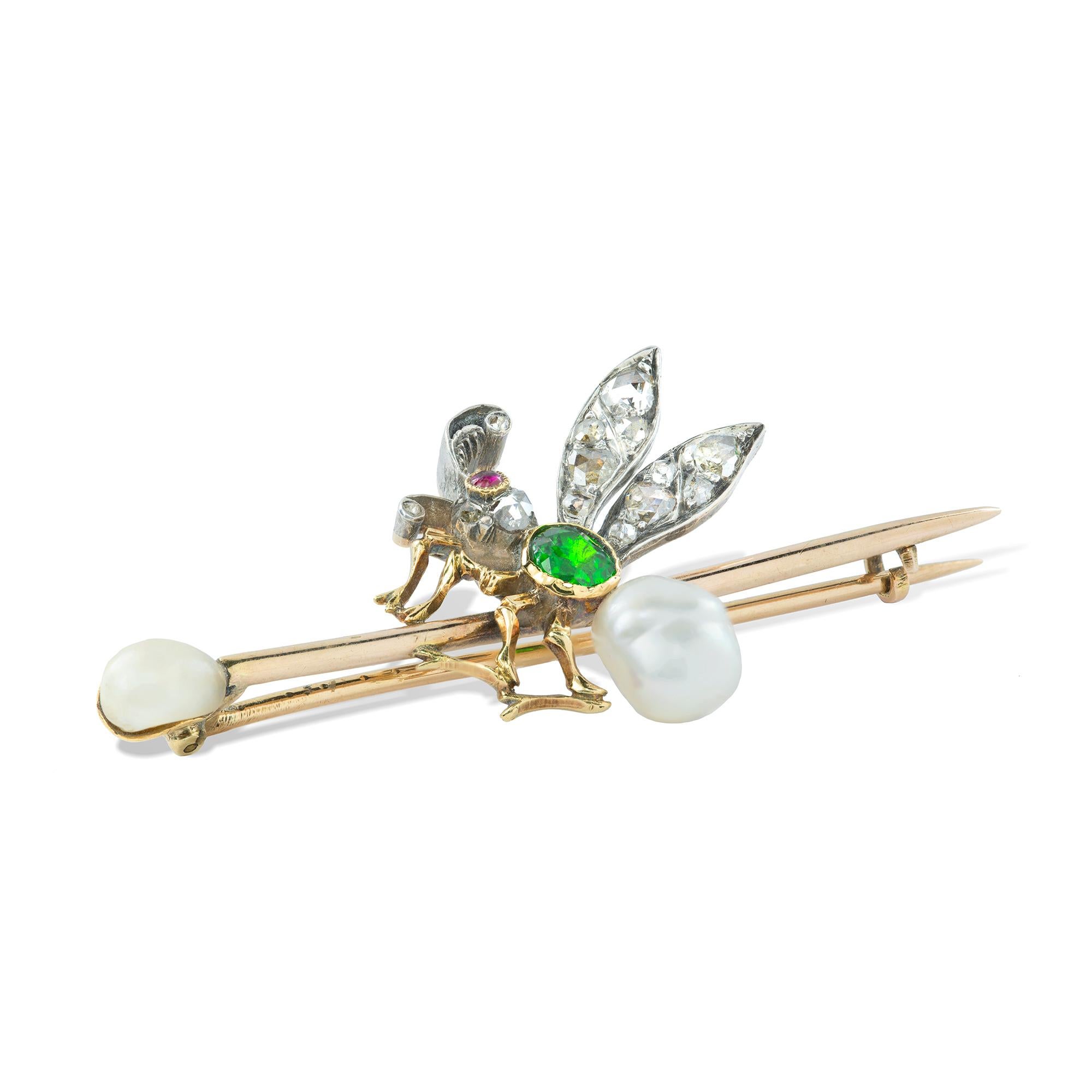 A late 19th century fly brooch, the bee set with a dementoid garnet, a ruby eye, diamond wings and a pearl body, set in silver and gold, with a further pearl to the gold bar brooch, circa 1890, measuring approximately 2.2x5.4cm, gross weight