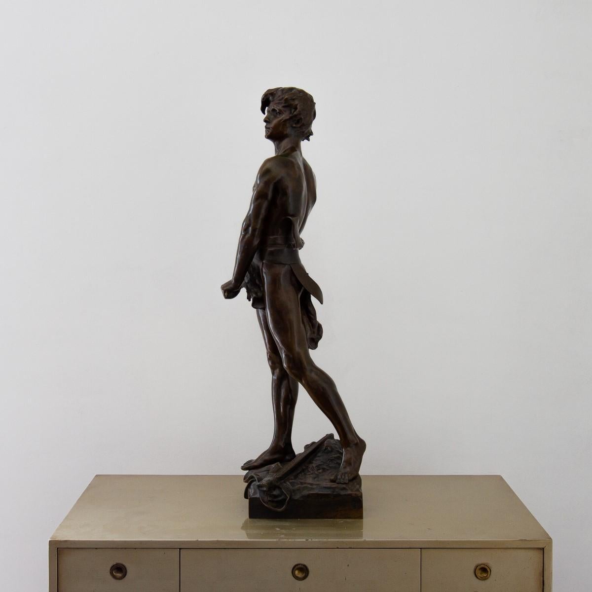 A late 19th century French bronze figure of a young man with a sword, titled 'Vingt Ans' by François-Raoul Larche and cast by Siot-Decauville Foundry, Paris. Signed Raoul Larche to the naturalistic base and the following inscription later added. 'il