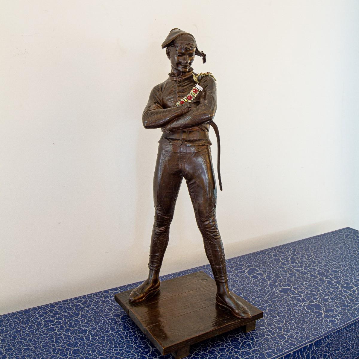 A late 19th century French bronze of a harlequin set on a bronze base simulating timber, after the model signed by René de Saint-Marceaux, stamped F Barbedienne Foundry, Paris and dated 1879, editioned 636 and complete with the A. Collas