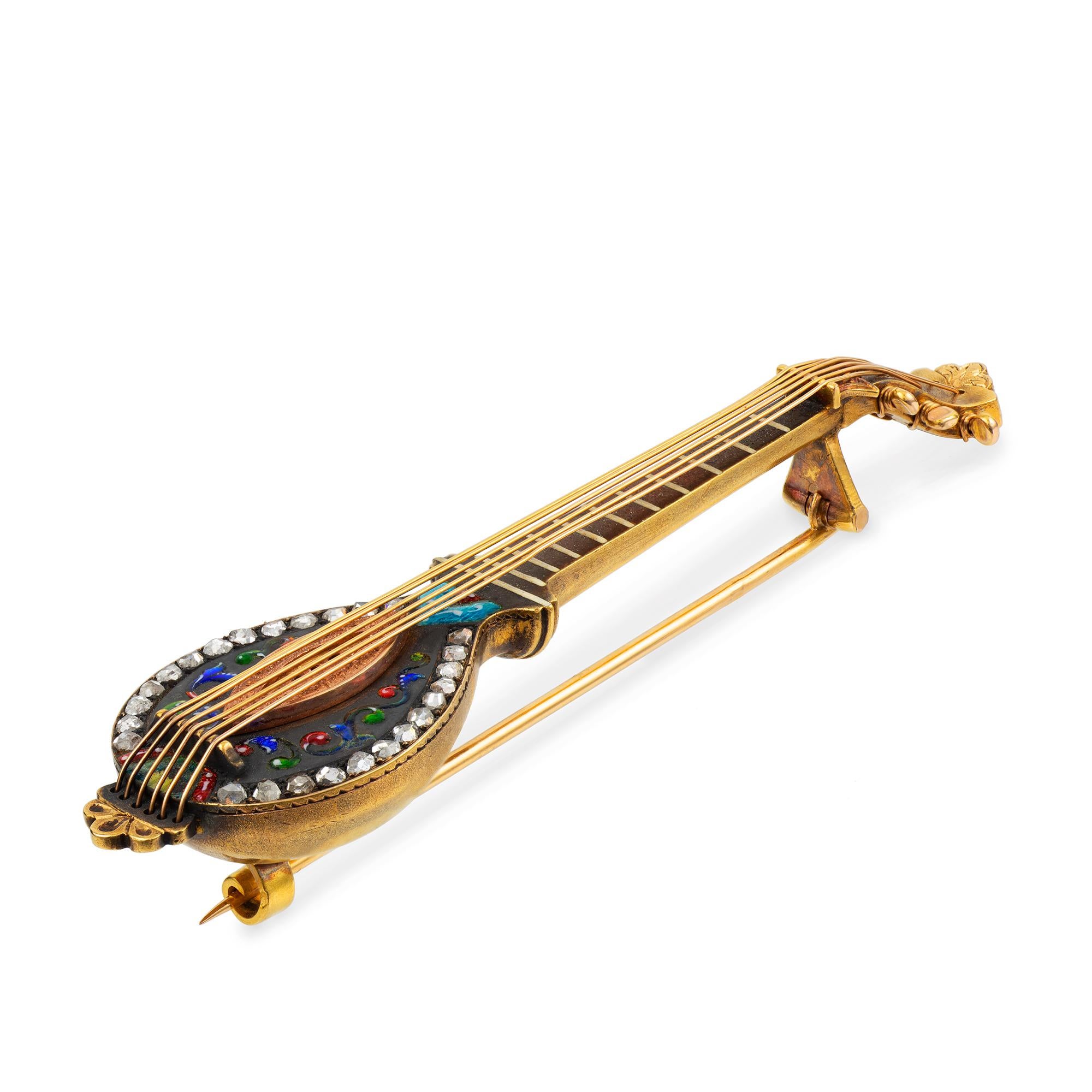 A late 19th century mandolin brooch, realistically formed and encrusted with rose-cut diamonds and multi-colour enamel, on a black patinated background within yellow gold mount, bearing French hallmark and makers-mark, measuring approximately 7 x