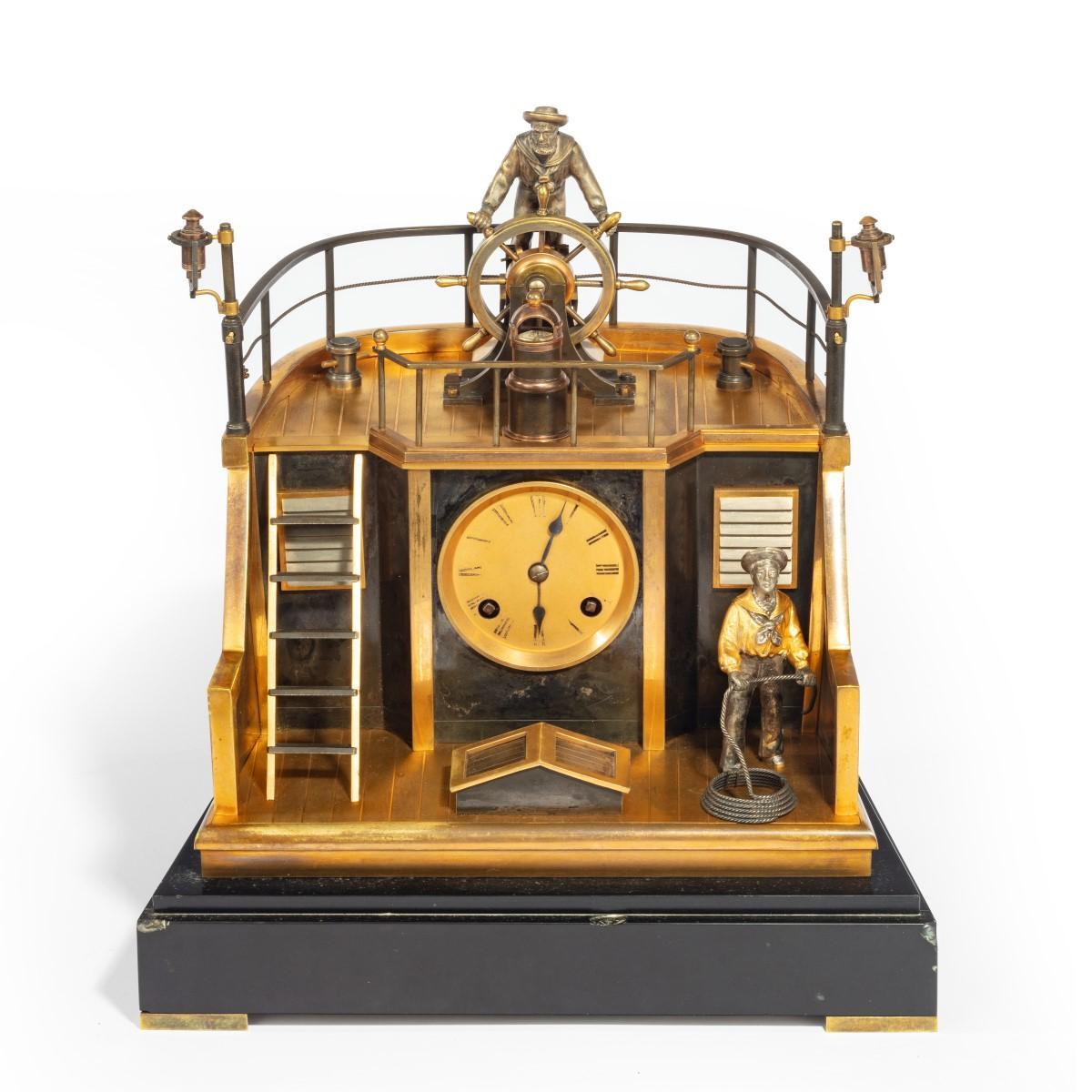 A late 19th century French gilt-brass and steel novelty ‘quarterdeck’ mantel clock by Guilmet, Paris, the eight-day gong striking movement with anchor escapement, circular gilt Roman numeral dial with steel spade hands, the case made as the stern of