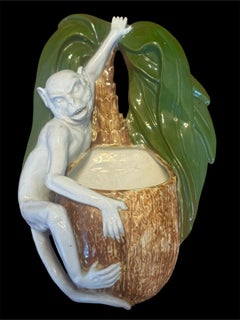 A late 19th century German Sitzendorf porcelain monkey and coconut wall bracket