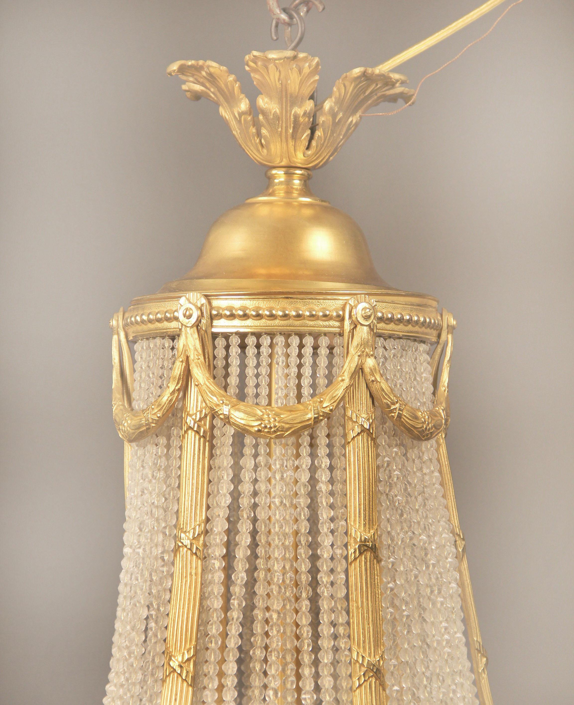 A late 19th century gilt bronze Empire Chandelier In Good Condition For Sale In New York, NY