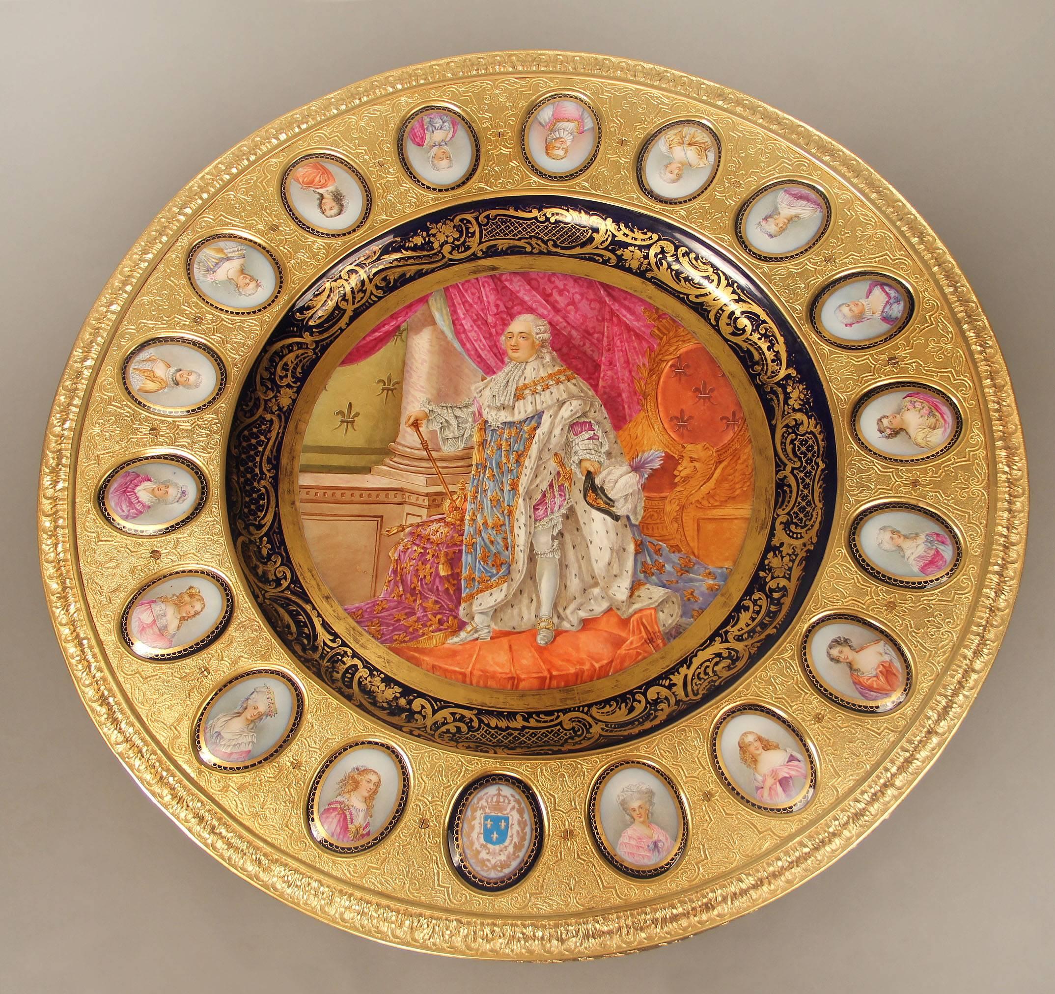 A beautiful late 19th century gilt bronze mounted Sèvres style porcelain centre table

The top centered with a large round plaque of Louis XVI in royal dress attire, surrounded by 18 oval plaques of the ladies of his court, sitting on a gilt
