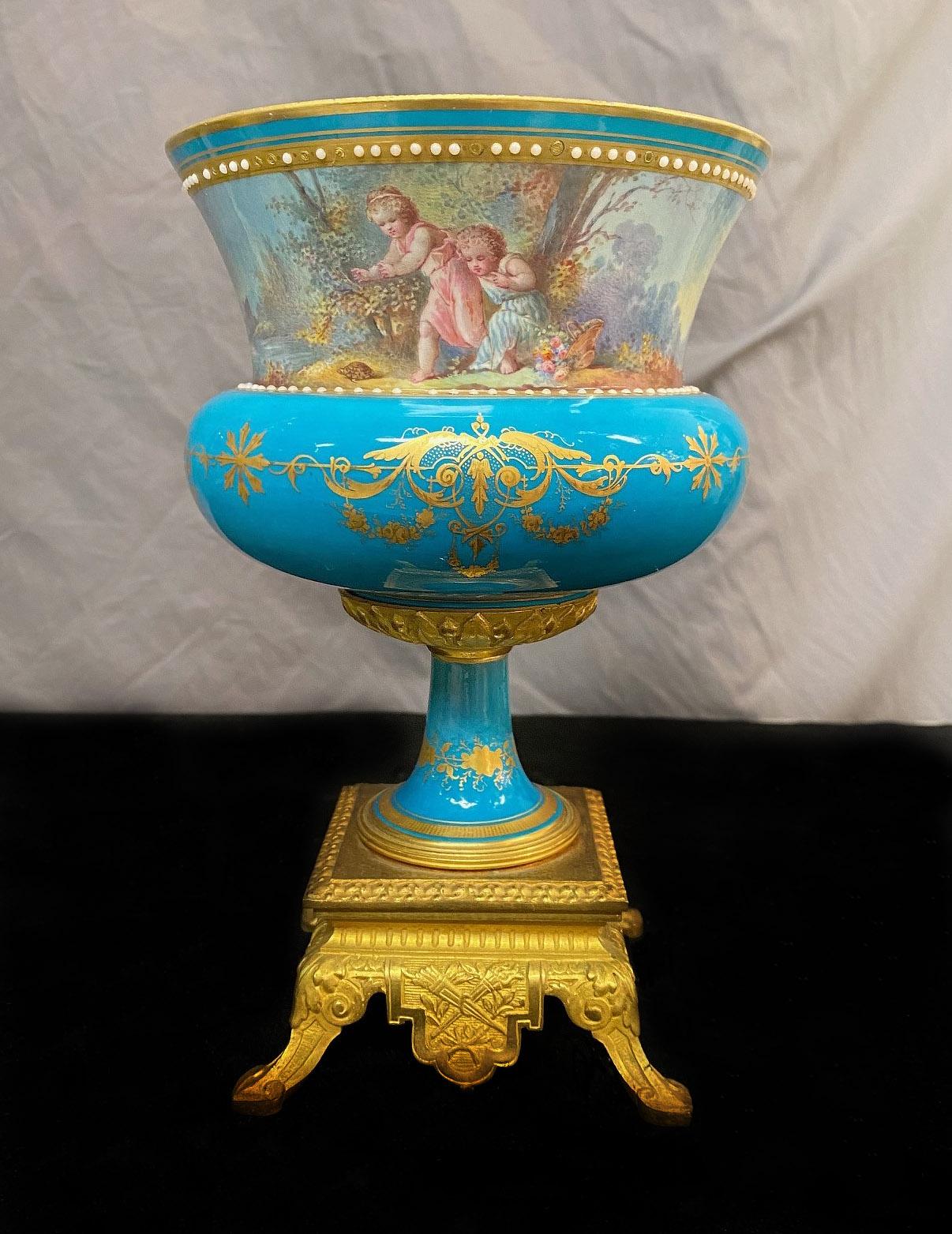 A late 19th century gilt bronze mounted turquoise sèvres style porcelain planter.

Detailed 