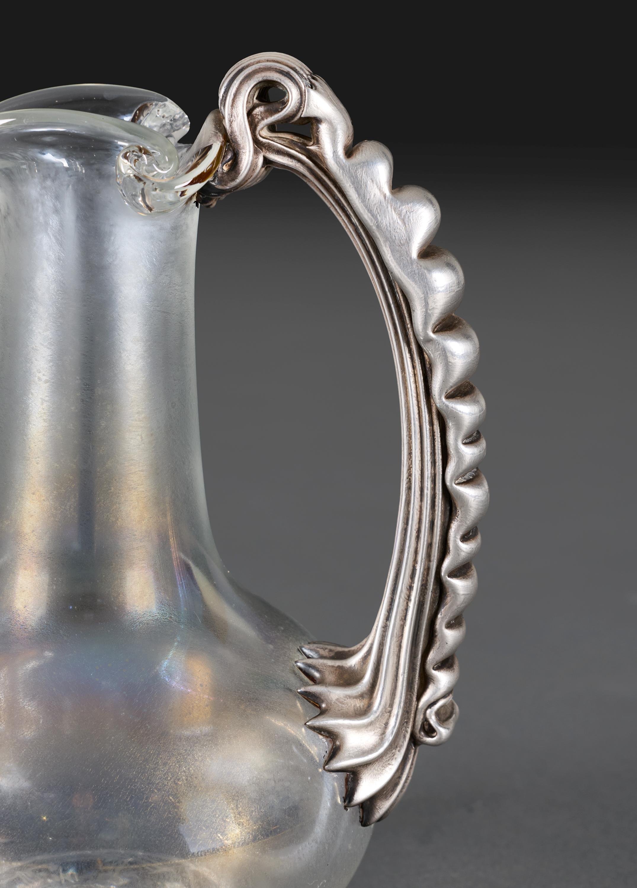Blown Glass A late 19th Century Iridescent Glass Water Jug with Silver Handle For Sale
