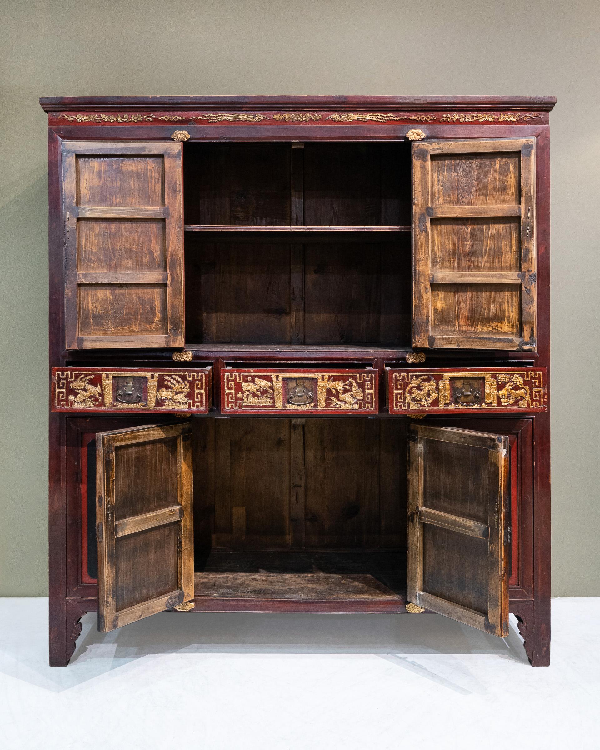 A late 19th century large carved cabinet from Dong Yang city, Zhejiang province, China. This cabinet is a distinct design of cabinets from this region, who are famed for their wood carvings. For both the top and bottom sections, only the middle