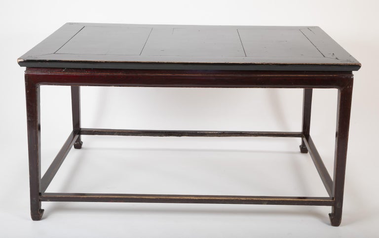 An impressive black lacquer center table, Chinese, Early 20th Century.