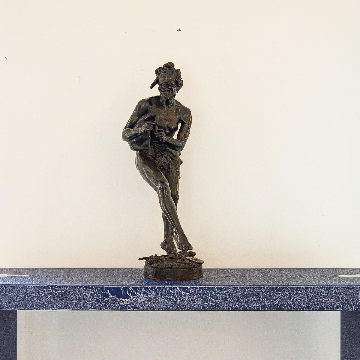 A late 19th century French bronze of a musician playing bagpipes, signed Tillmant.